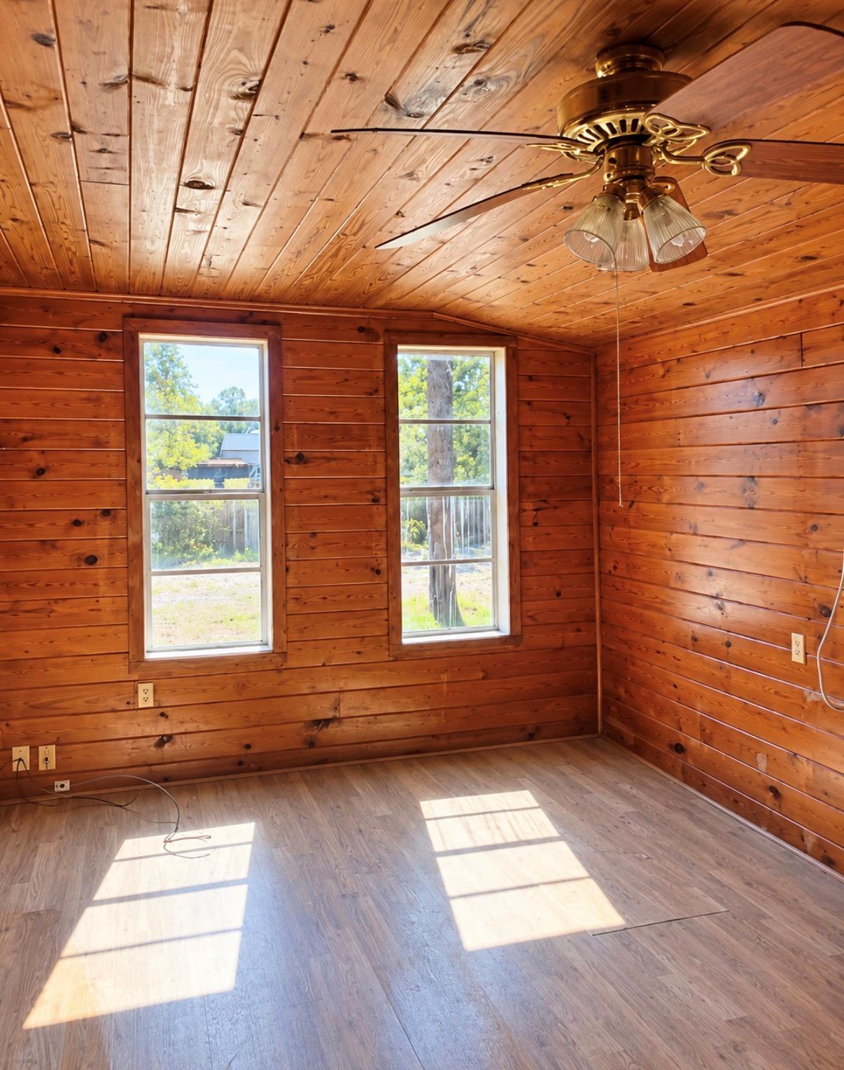 Rich wood paneling runs from the walls to the cei
