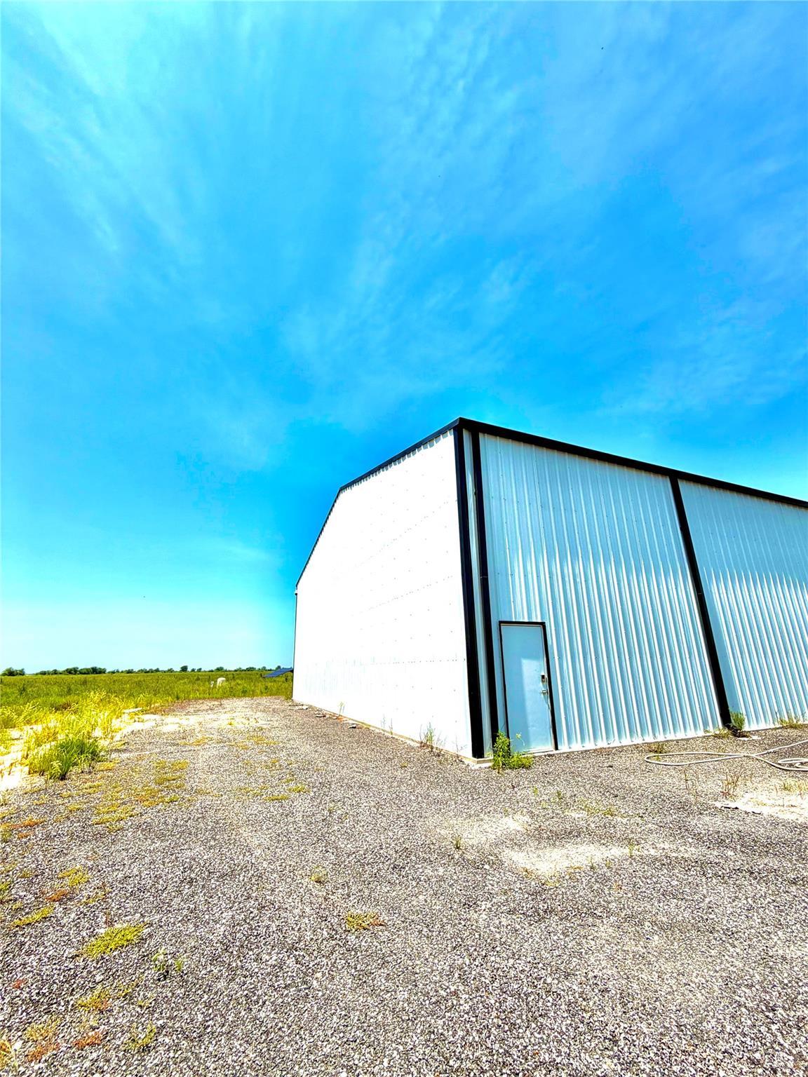A spacious, industrial building with a vast surro