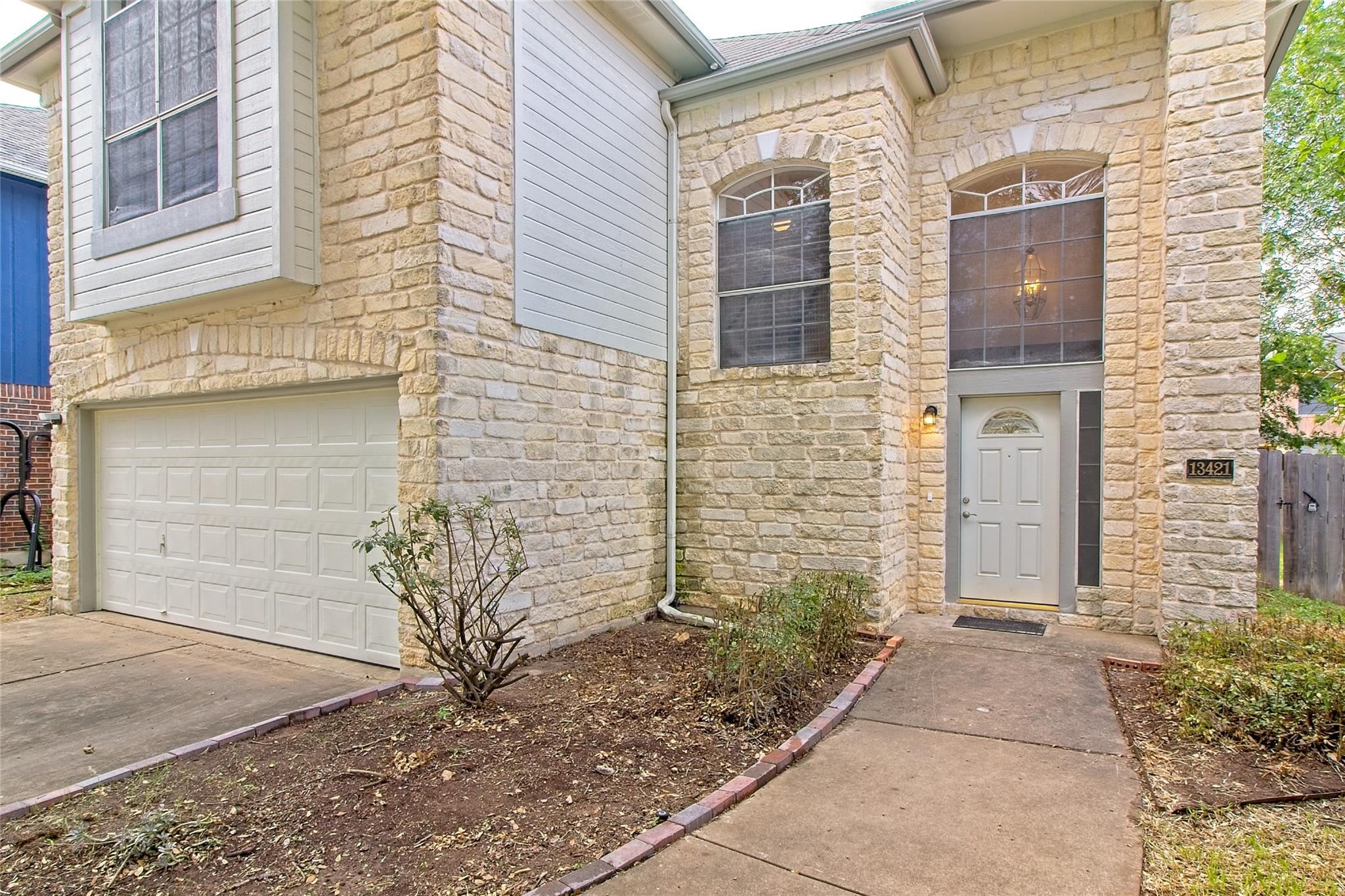 A cream-colored brick facade provides a welcoming