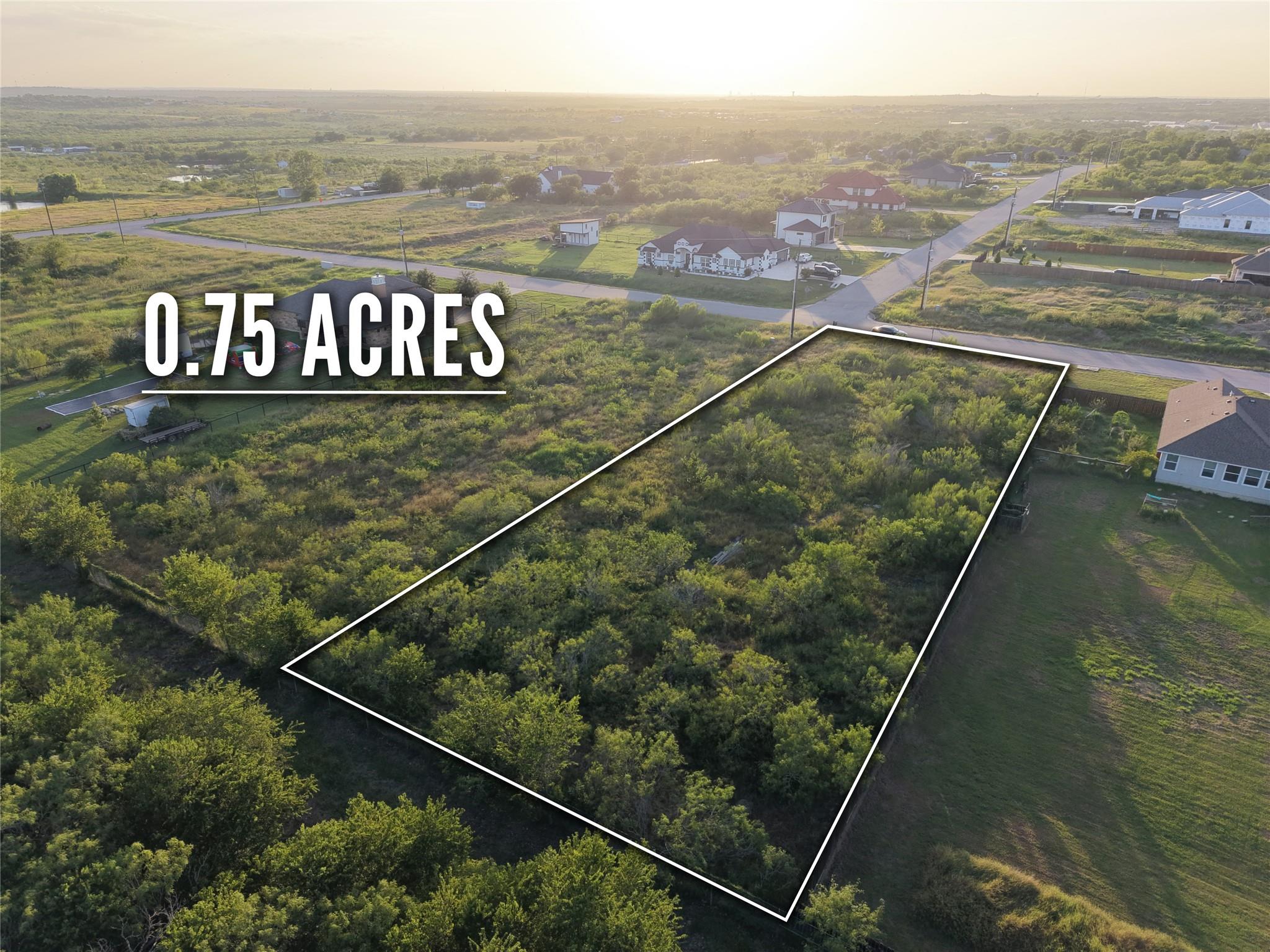 A spacious, undeveloped lot awaits your vision, s