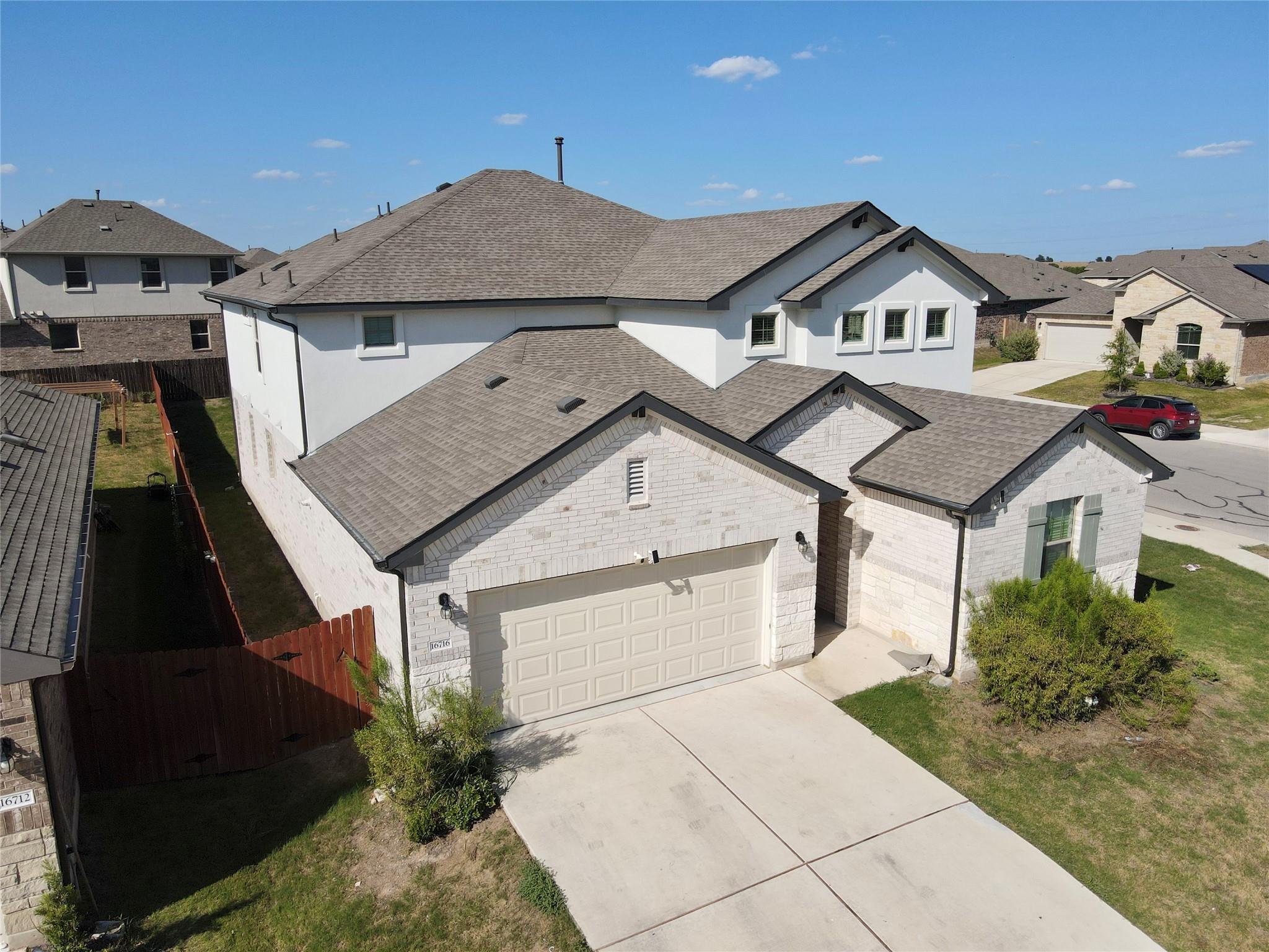 A striking modern home with light brick and white