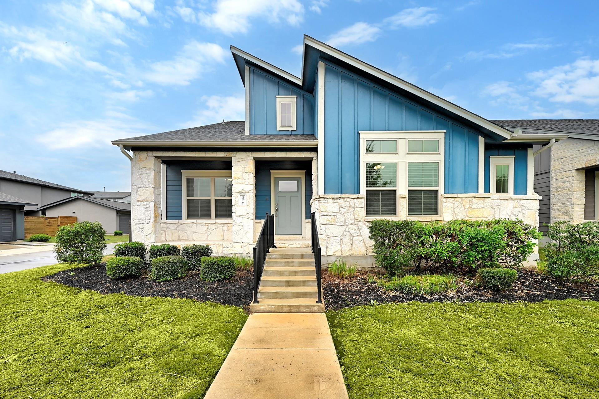 View of front facade with board and batten siding