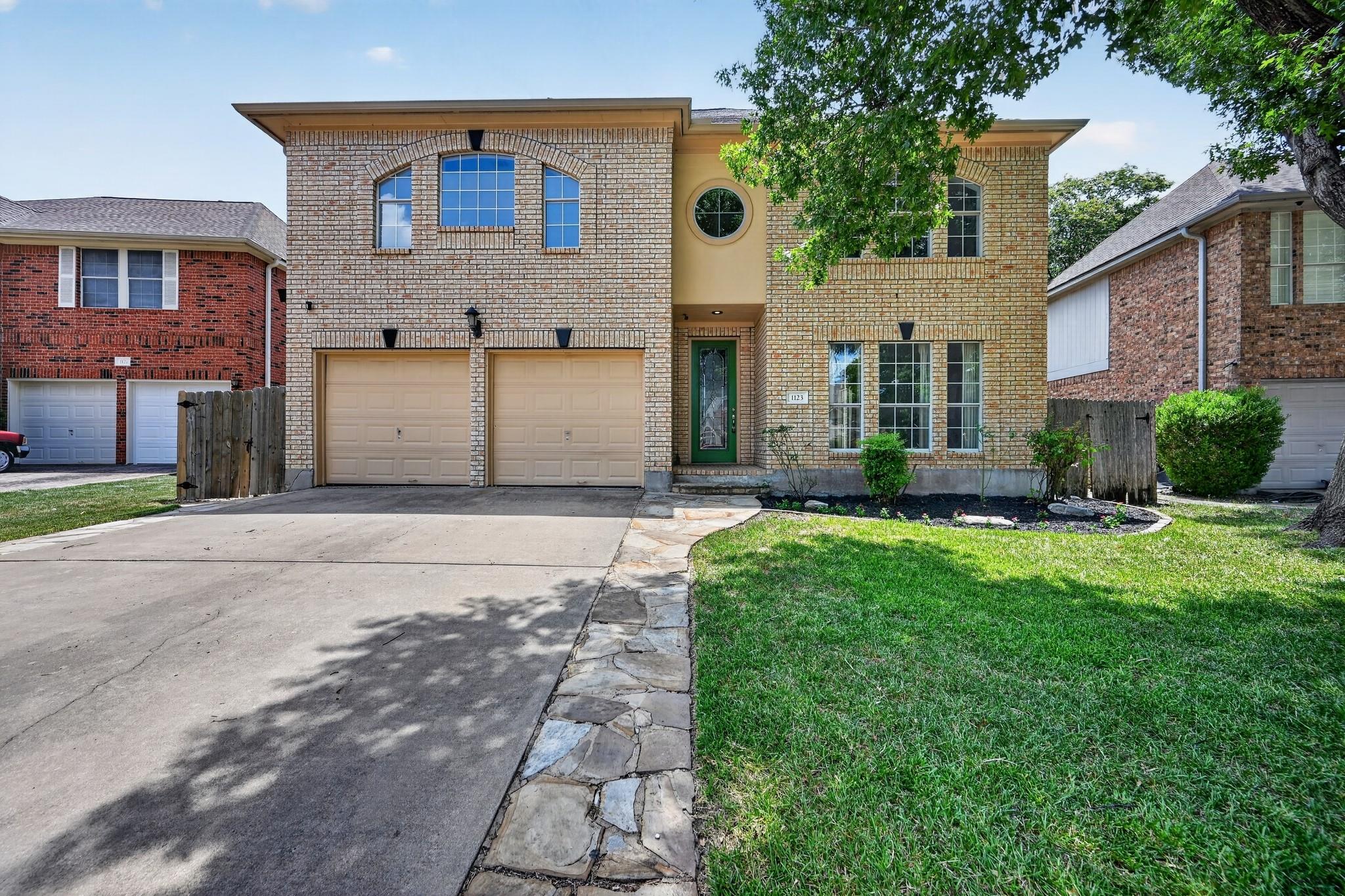 A classic brick exterior with arch-top windows an