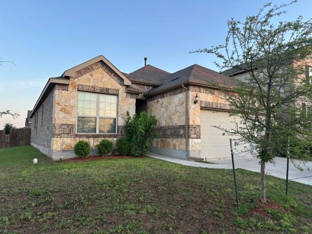 A well-maintained lawn introduces this charming s