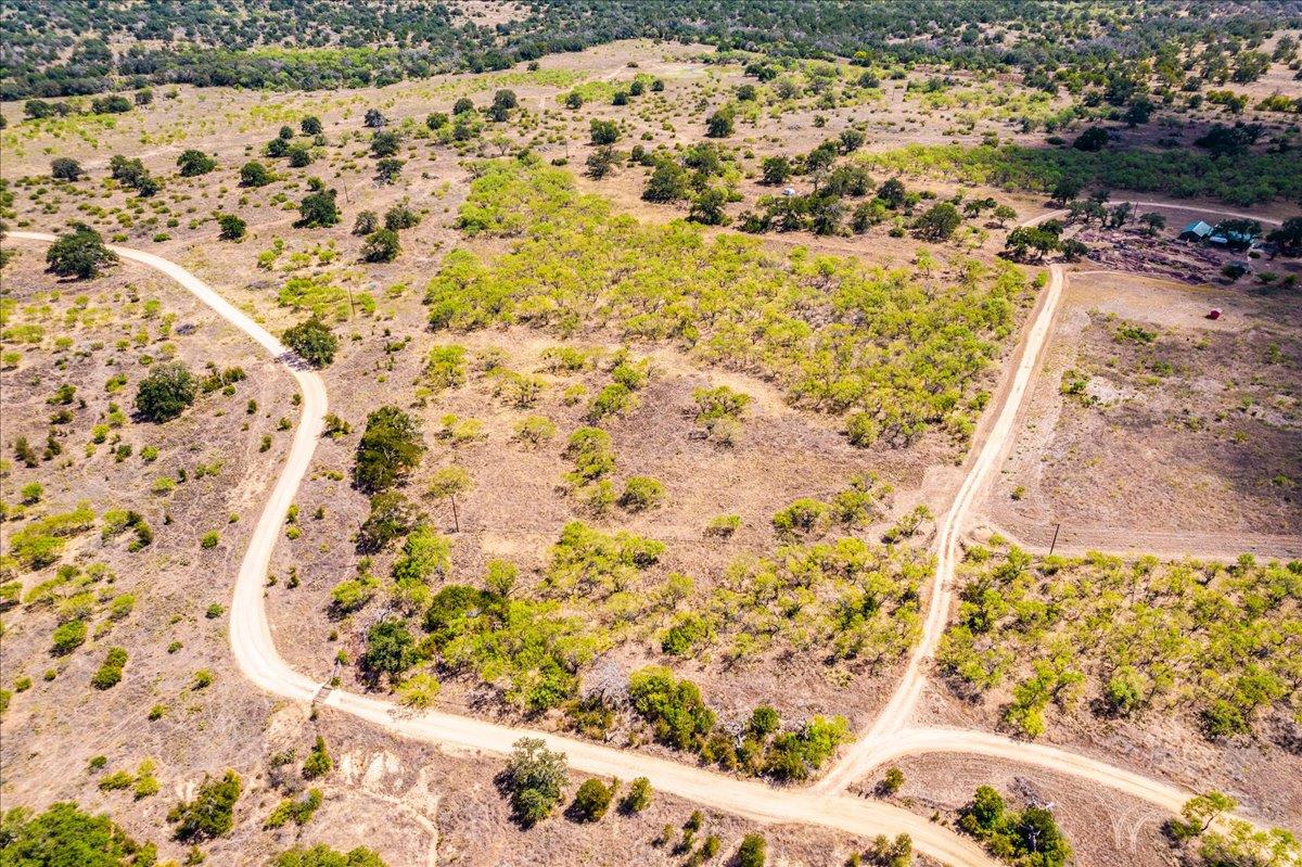 A sweeping aerial view showcases winding dirt roa