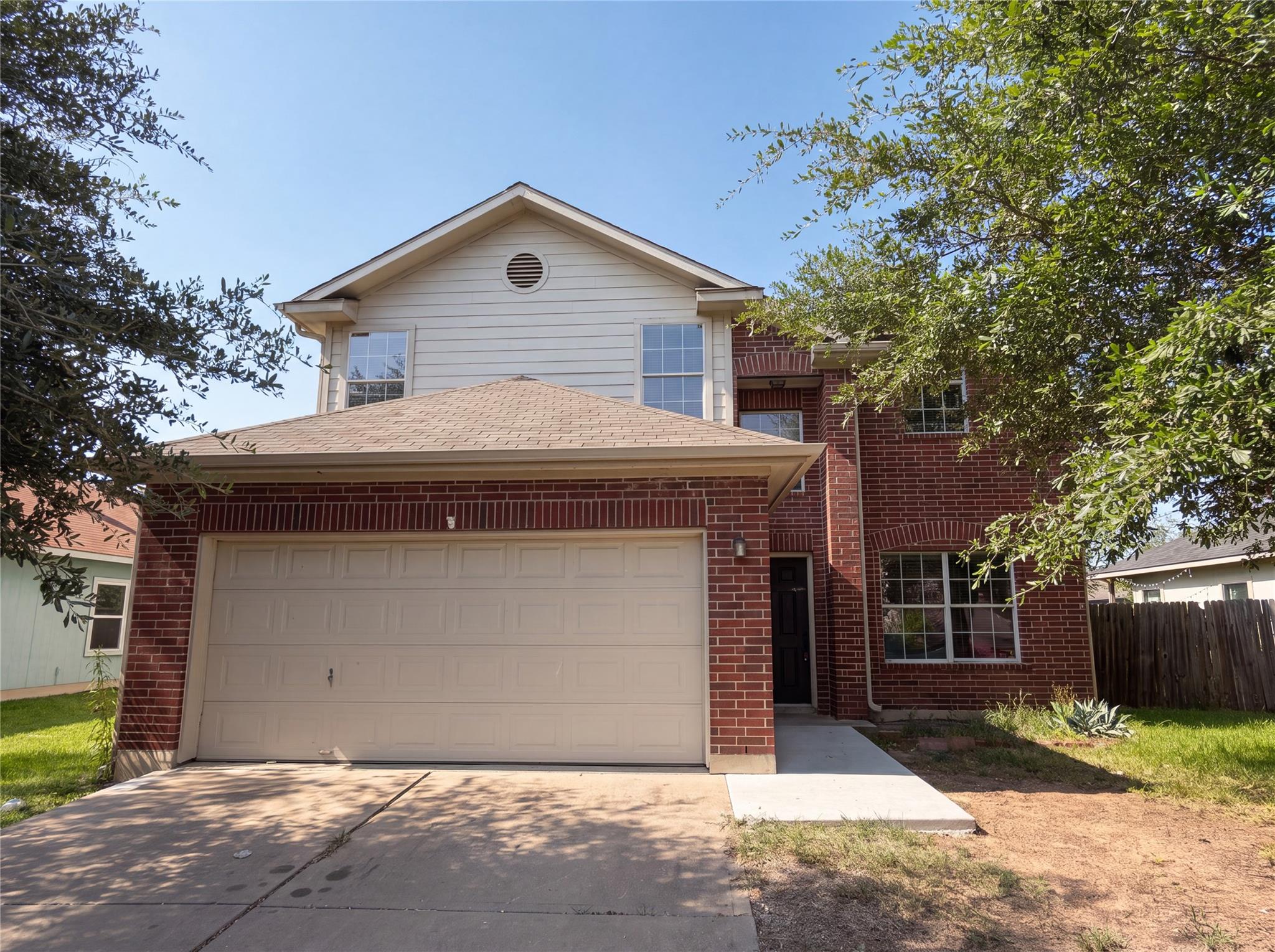 A classic brick facade and integrated garage offe