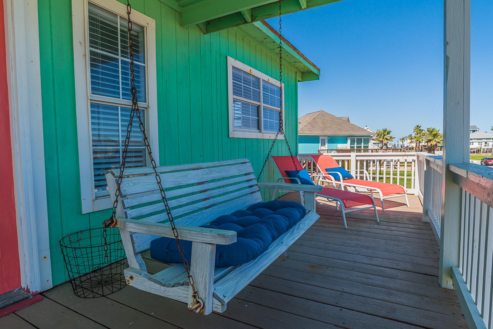 Relax on this charming covered porch swing, enjoy