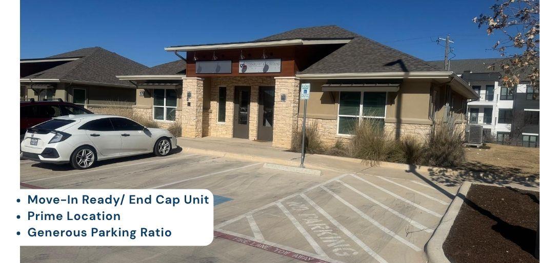 A commercial building with ample parking space of