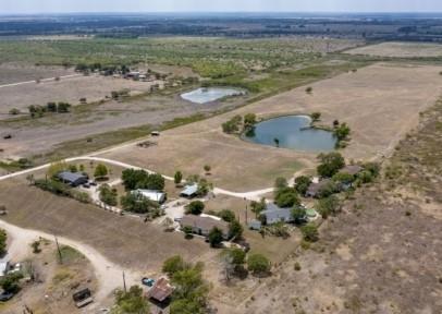 Rural acreage provides an idyllic setting with mu