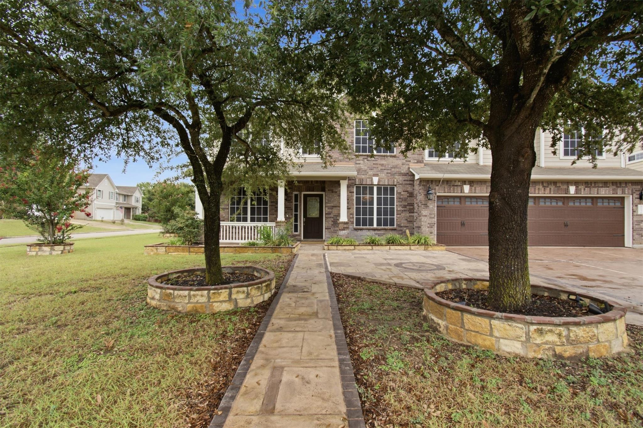 A stone pathway leads to a welcoming front porch 