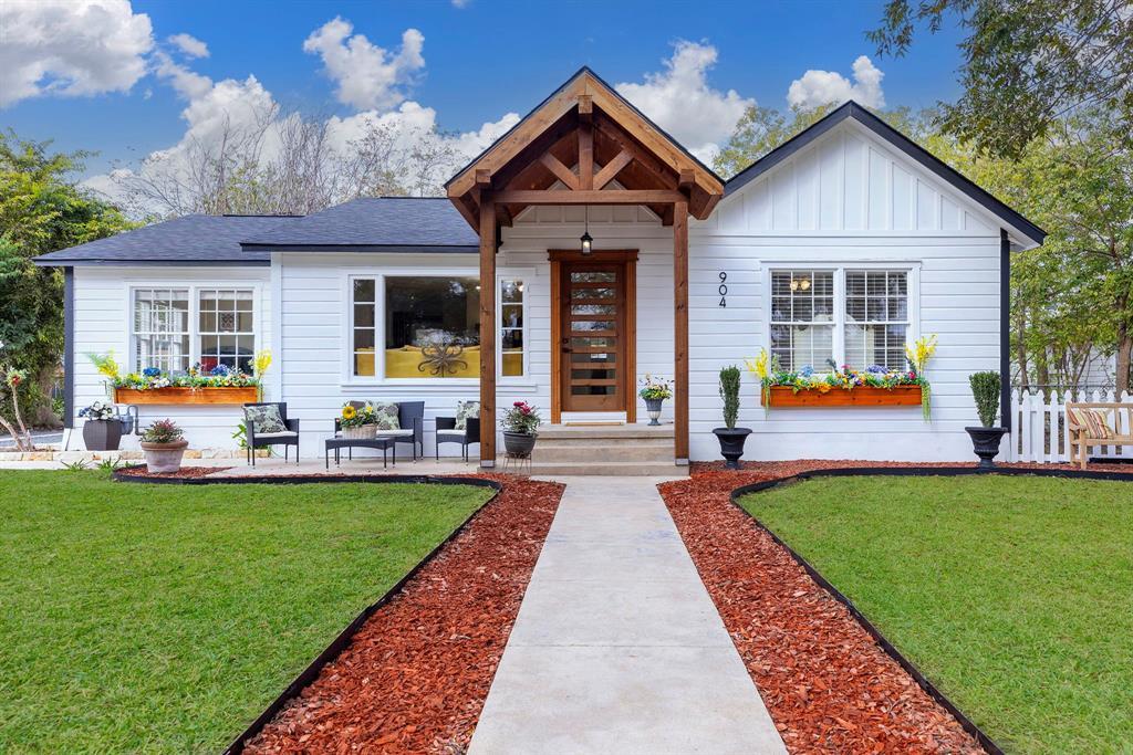 A welcoming front entry features a natural wood o