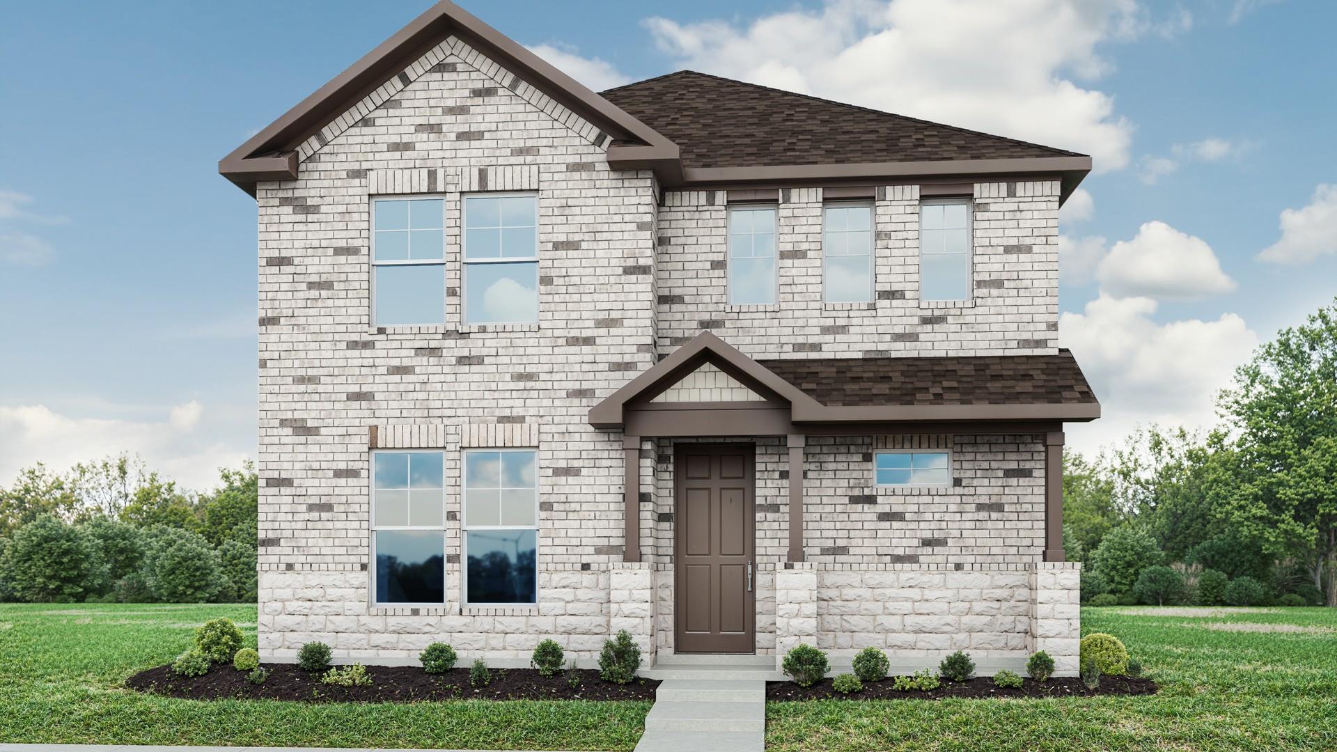 A charming two-story home with a classic brick fa