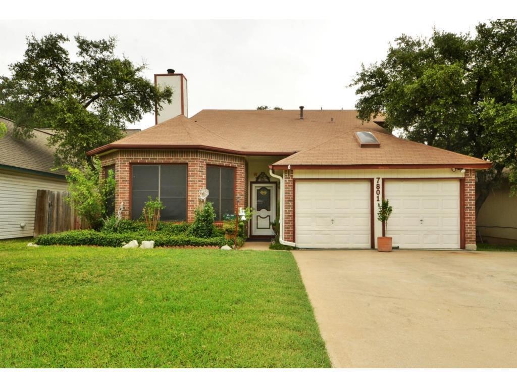 A classic brick exterior with well-maintained lan