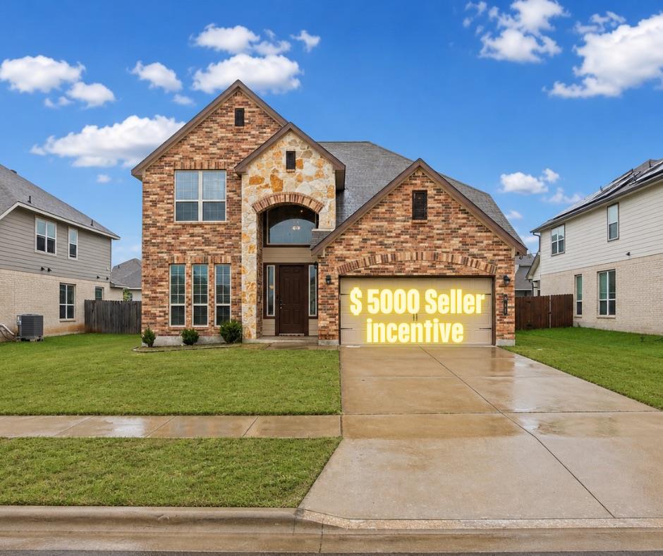 A classic brick and stone facade welcomes you hom
