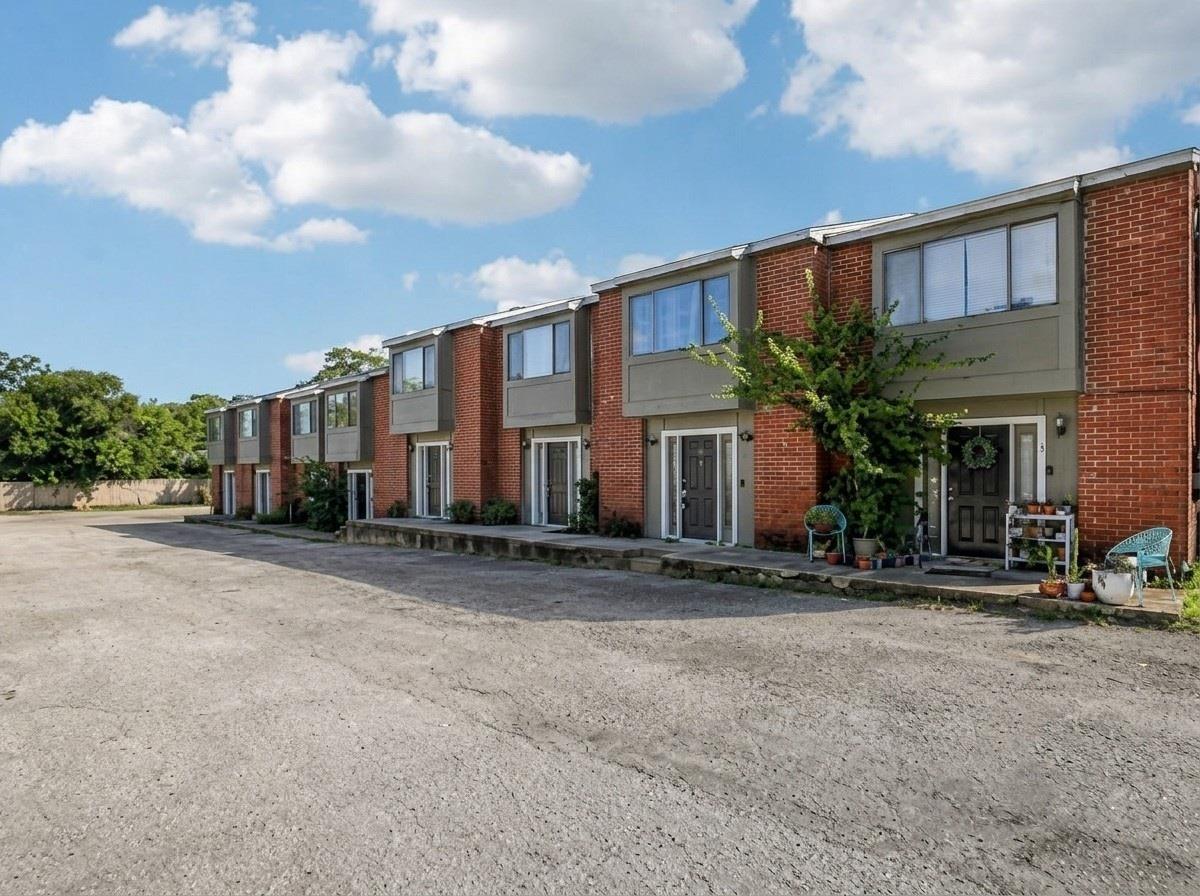 Rows of townhomes feature classic brick facades a