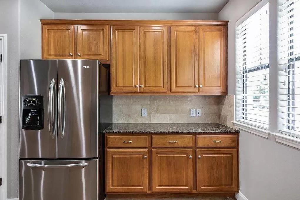 A well-appointed kitchen showcasing rich wooden c