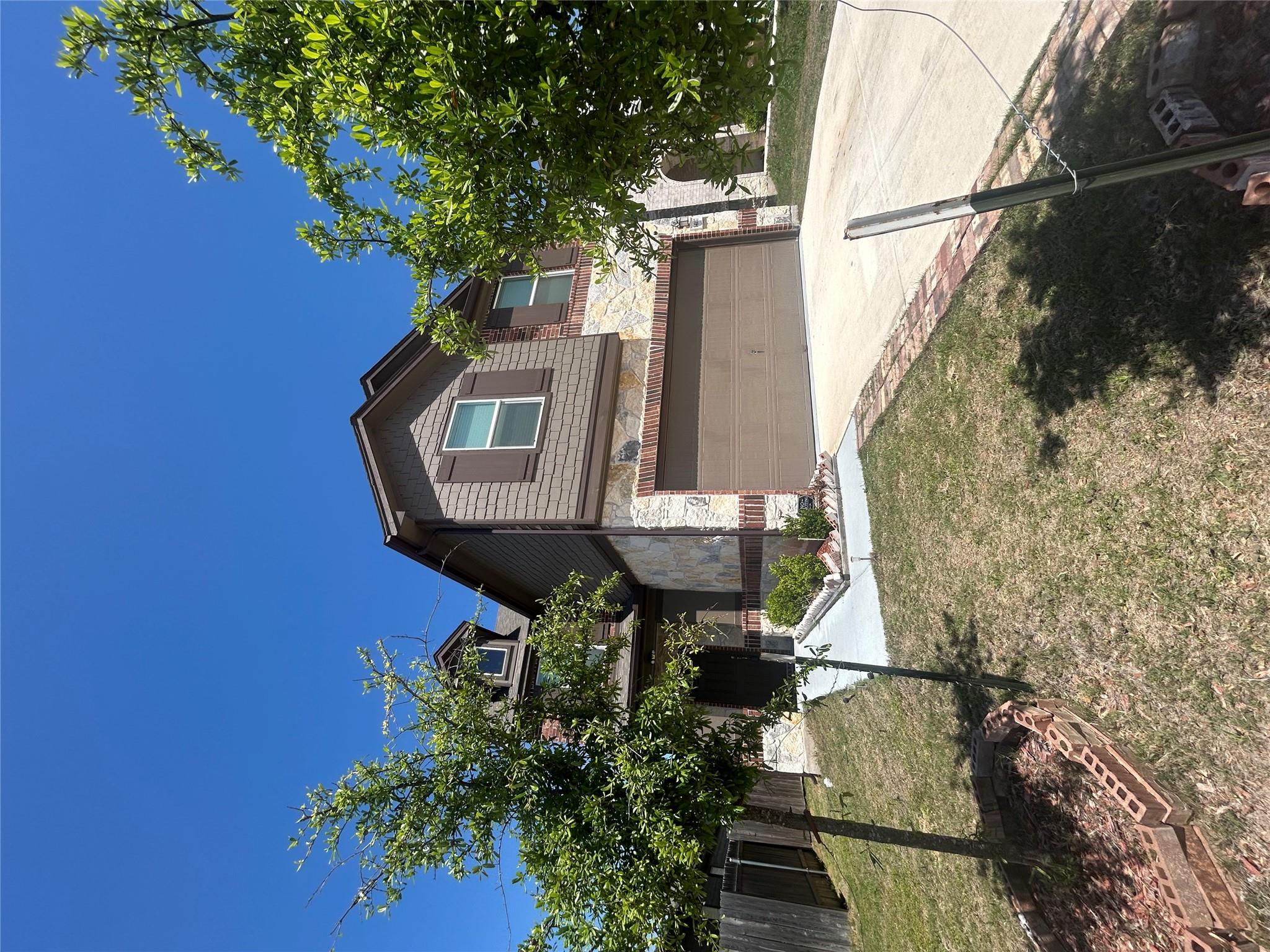A well-maintained two-story home presents an invi