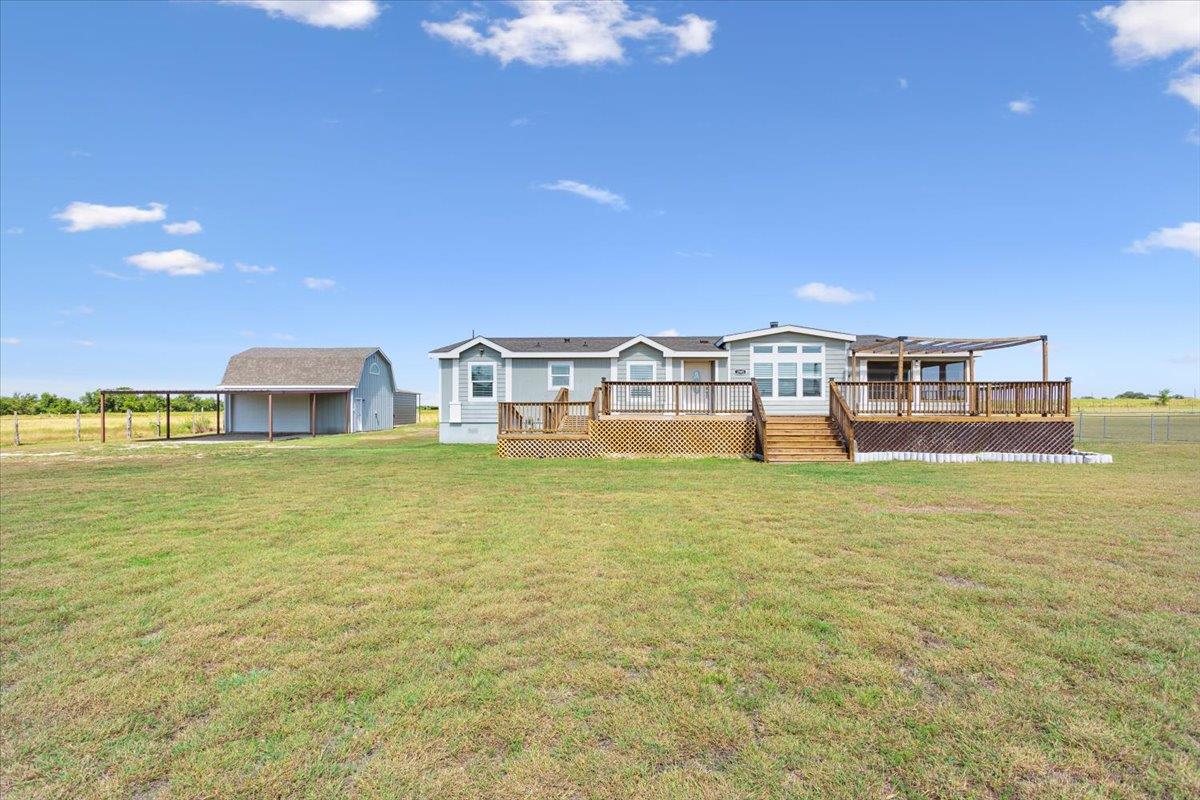A spacious home with multiple decks offers genero