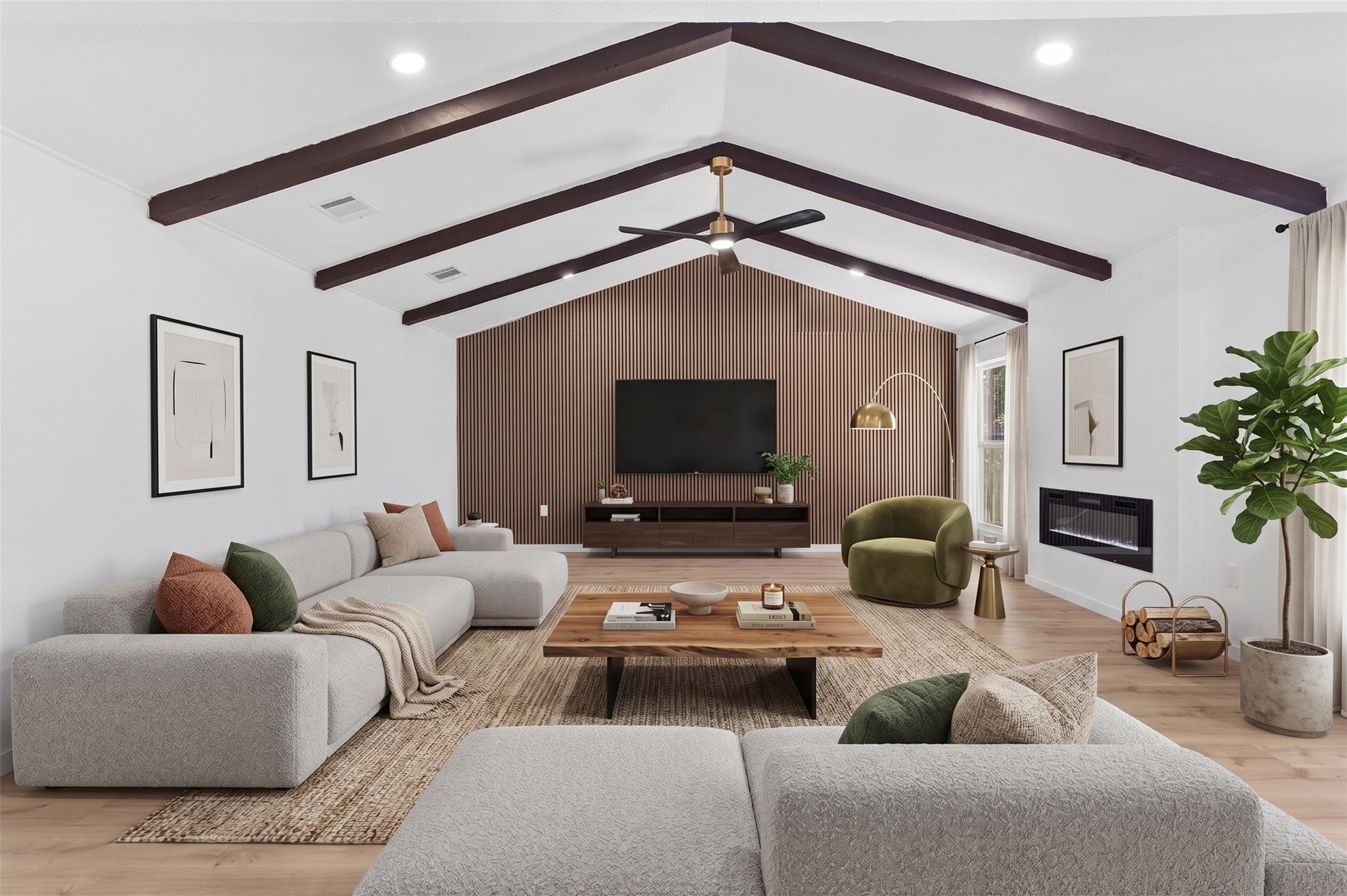 Exposed wood beams accent the vaulted ceiling of 