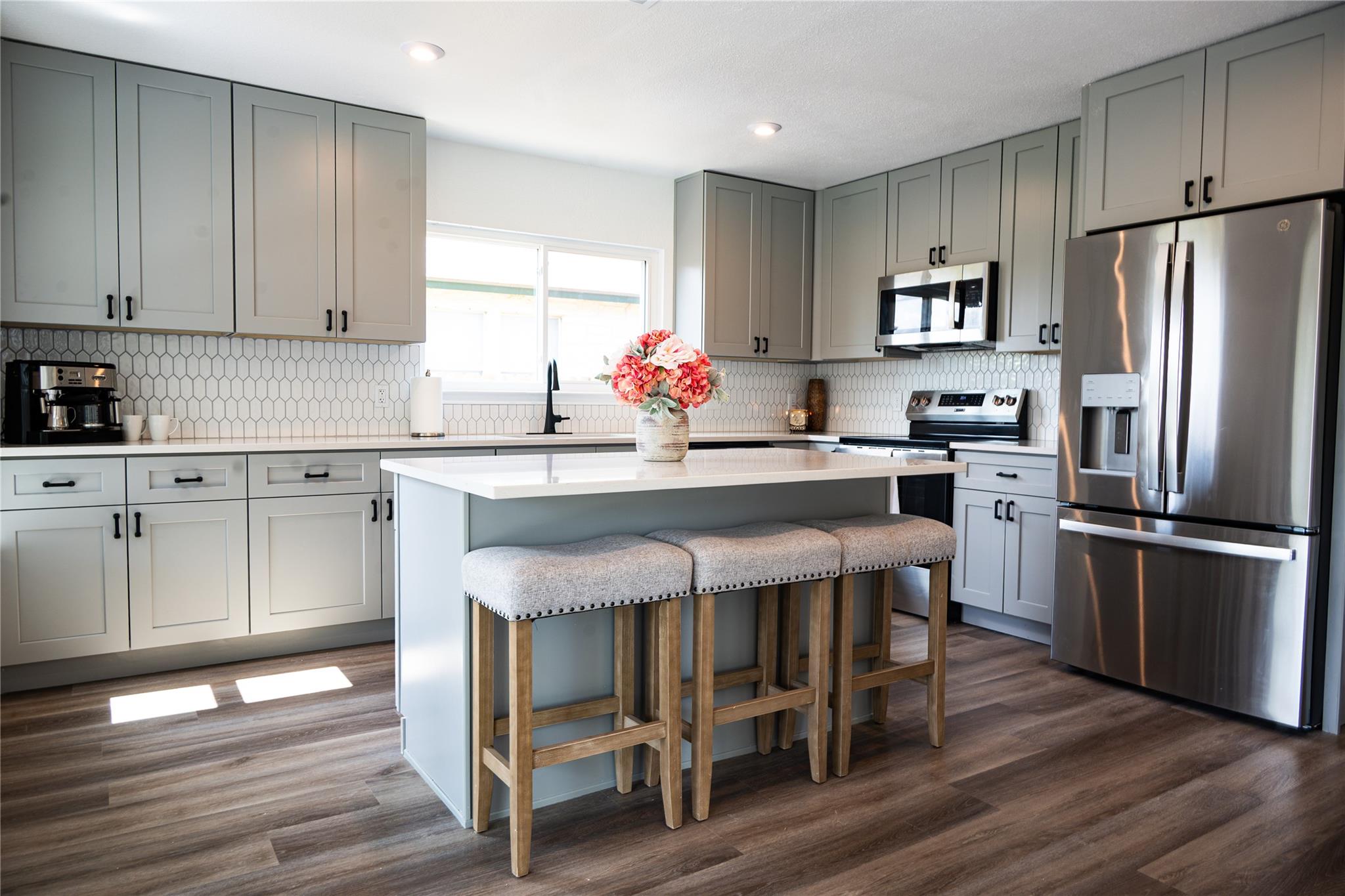 A well-lit kitchen with sleek cabinetry and an in