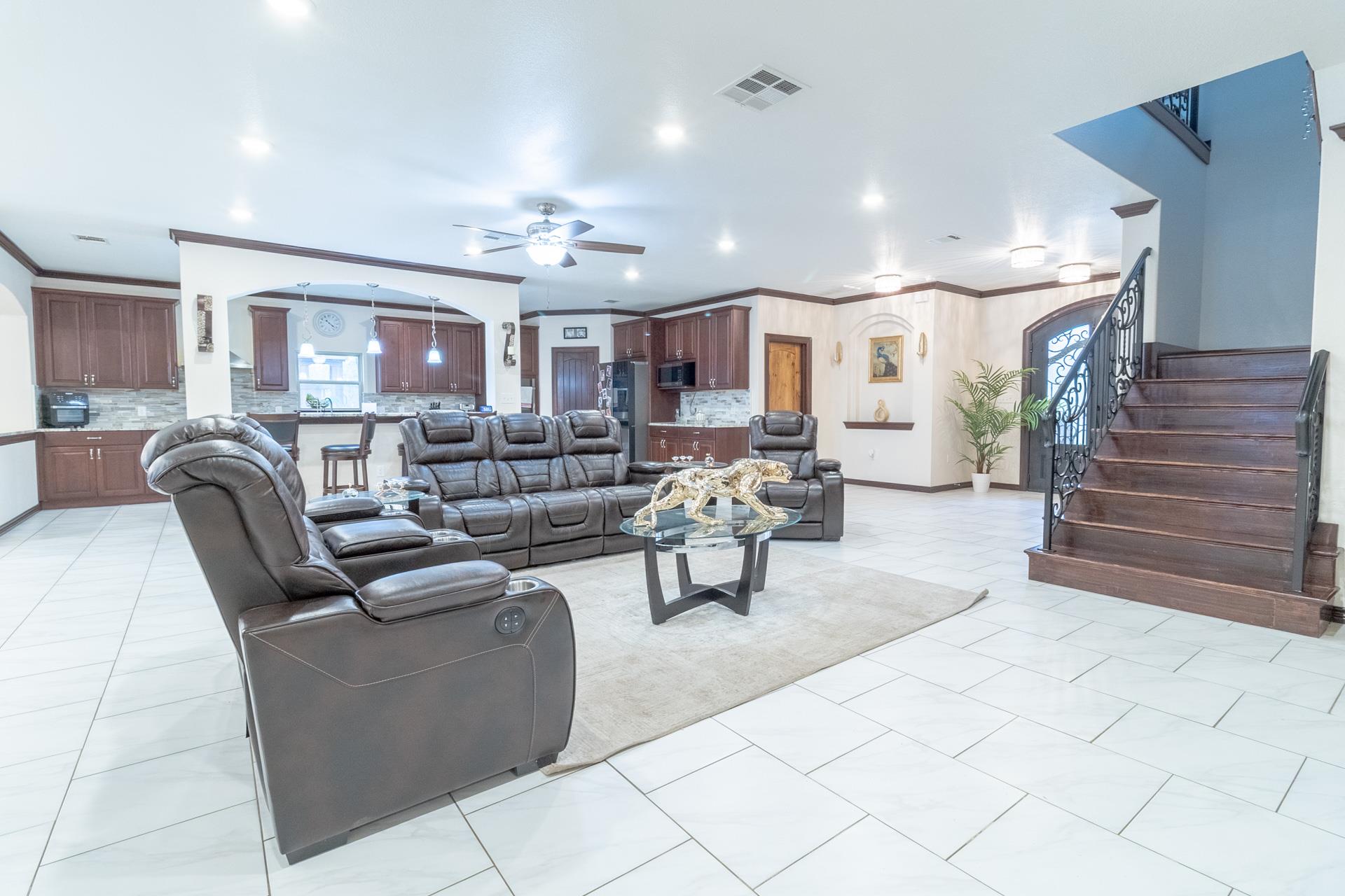An open-concept living area with tile flooring se