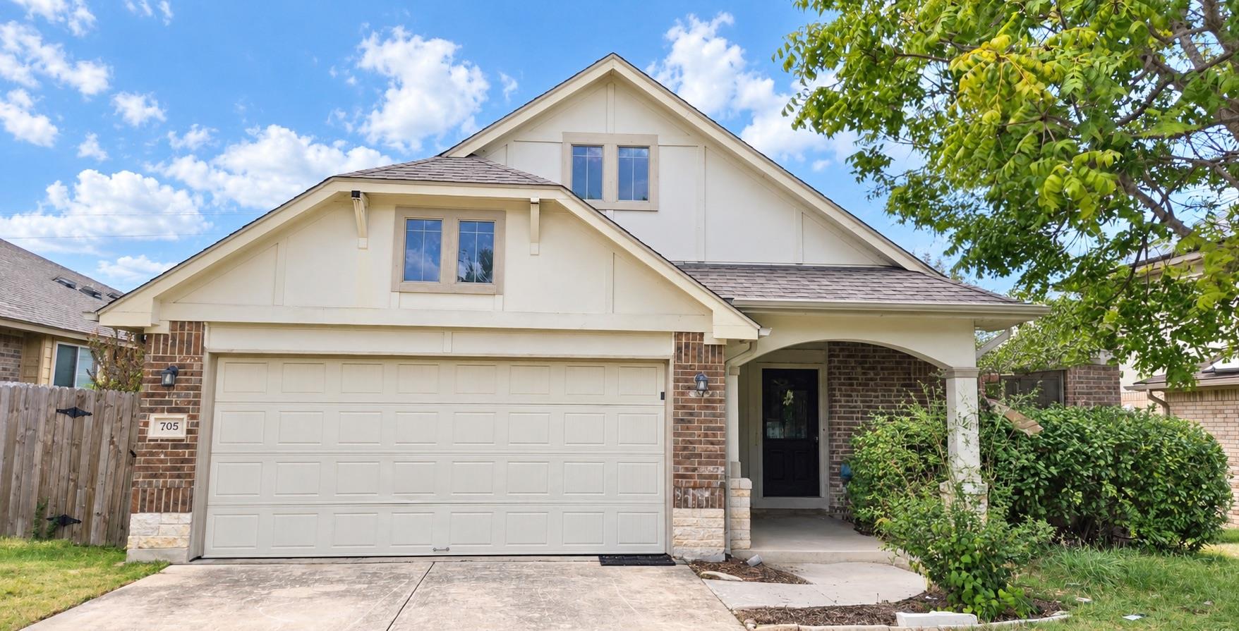 Charming gabled roofs and brick accents define th