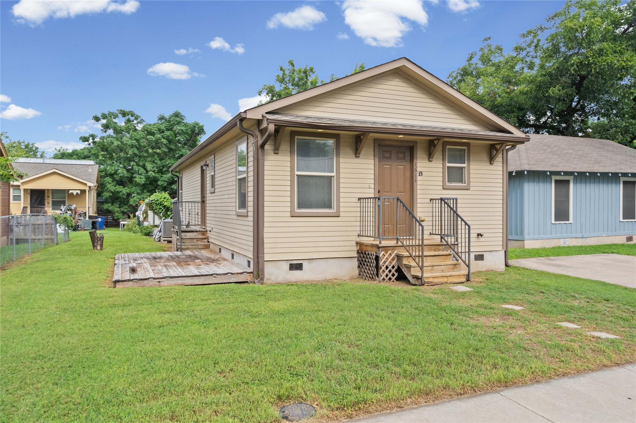 A modest dwelling featuring neutral siding and we
