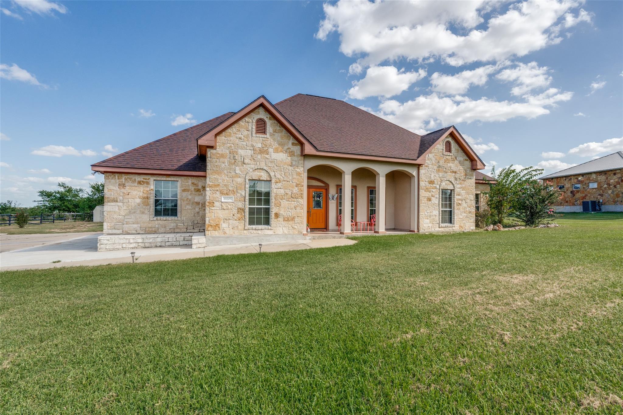 A traditional stone facade graces this inviting r