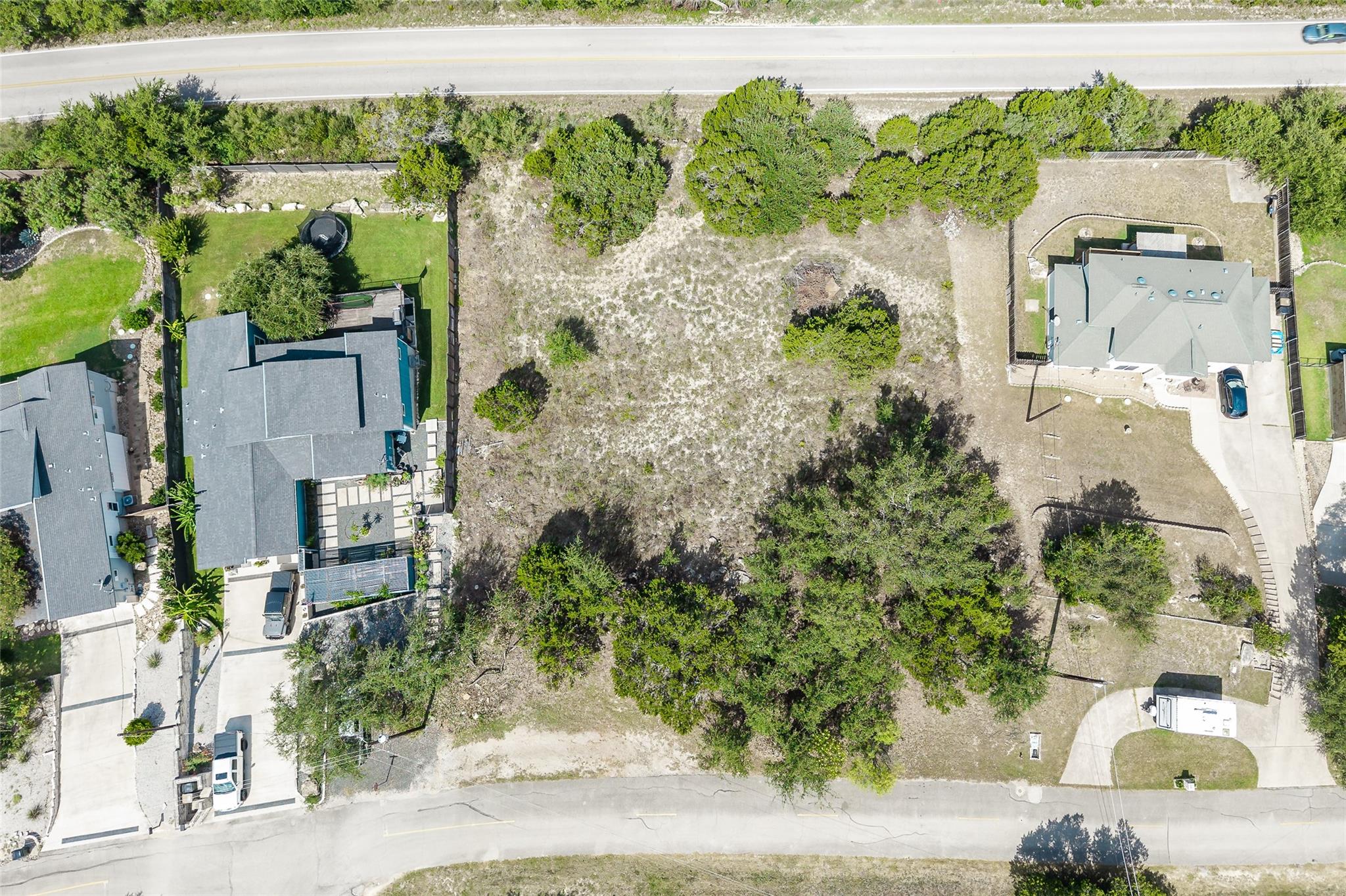 A spacious, undeveloped lot awaits your vision, n