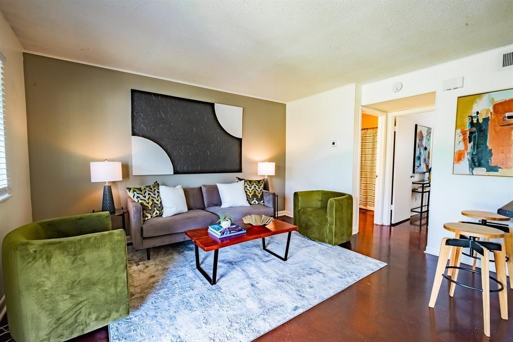 Rich hardwood floors complement this inviting liv