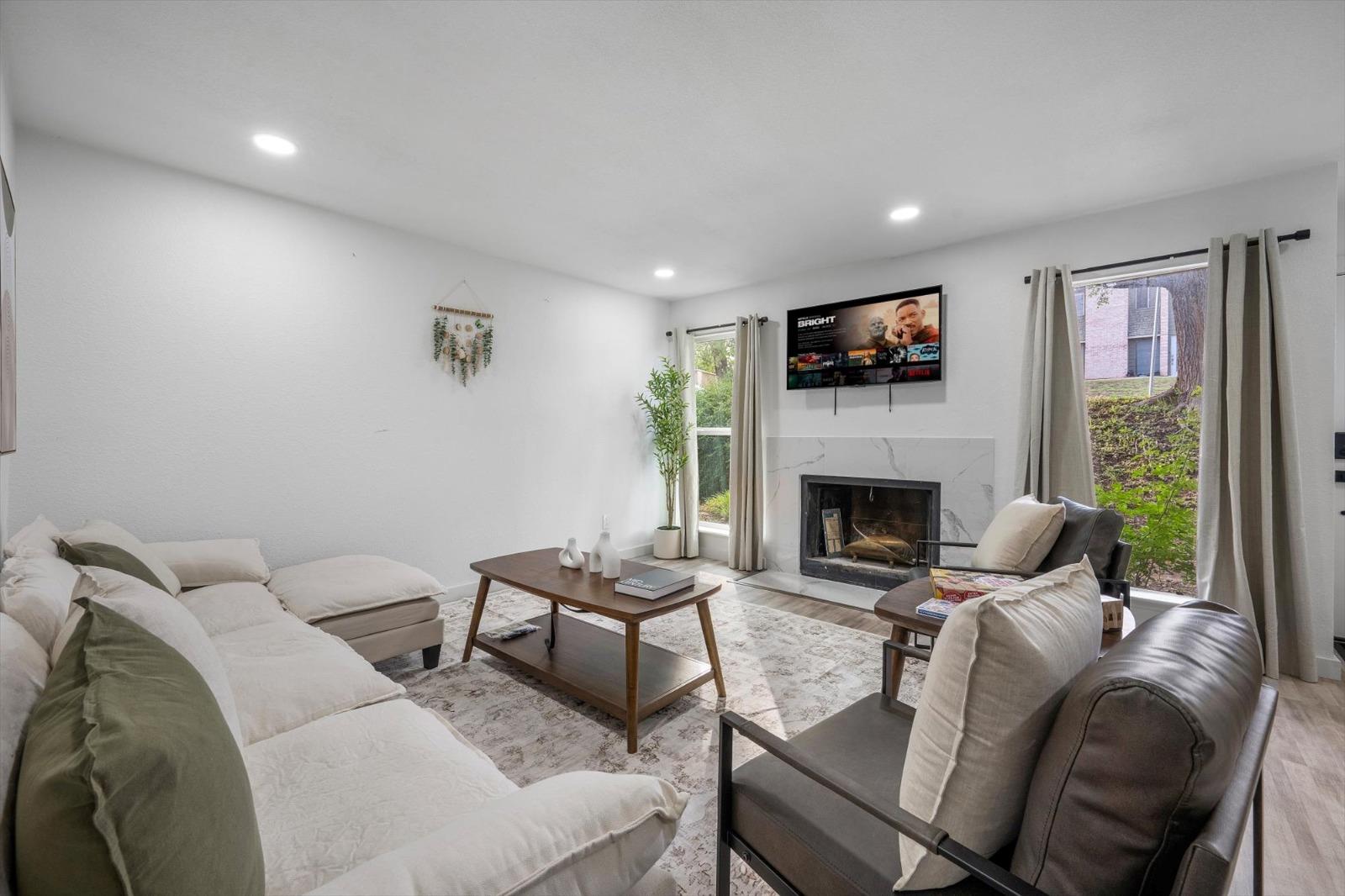 Recessed lighting illuminates this inviting livin
