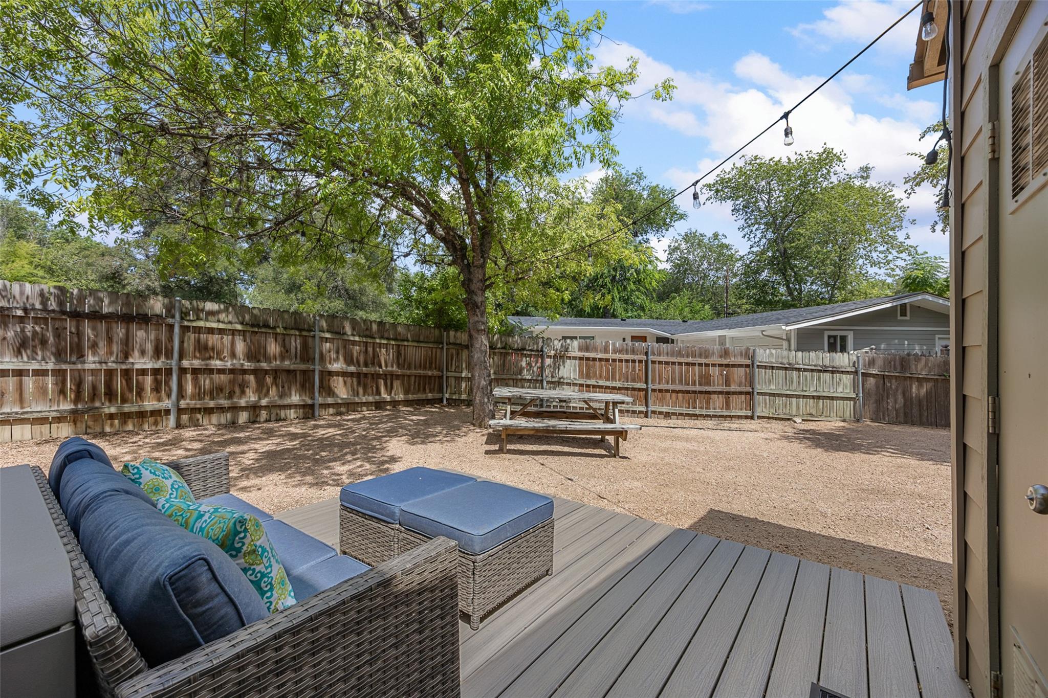 A spacious backyard retreat features a durable wo