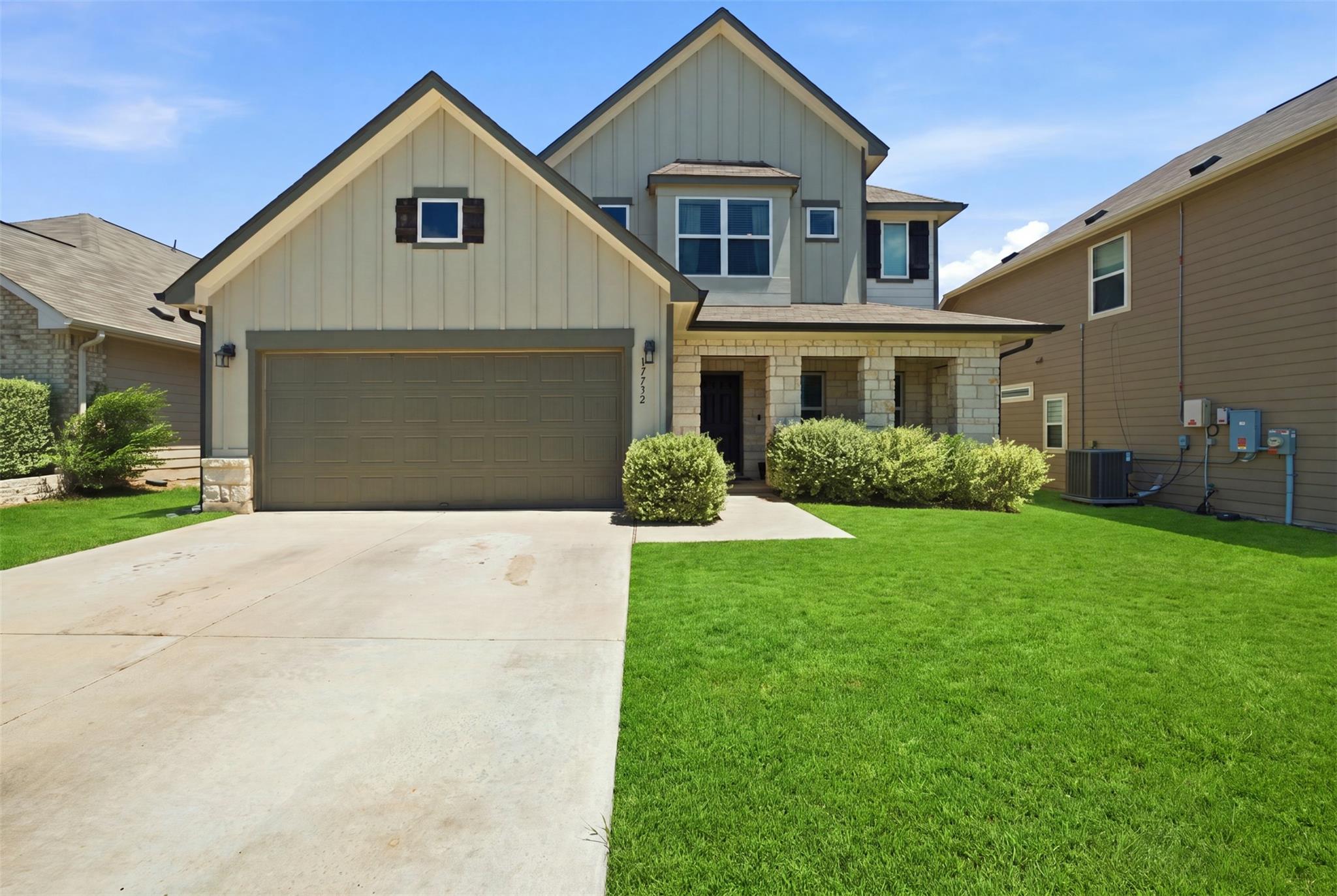 A well-maintained lawn and sturdy stone facade en