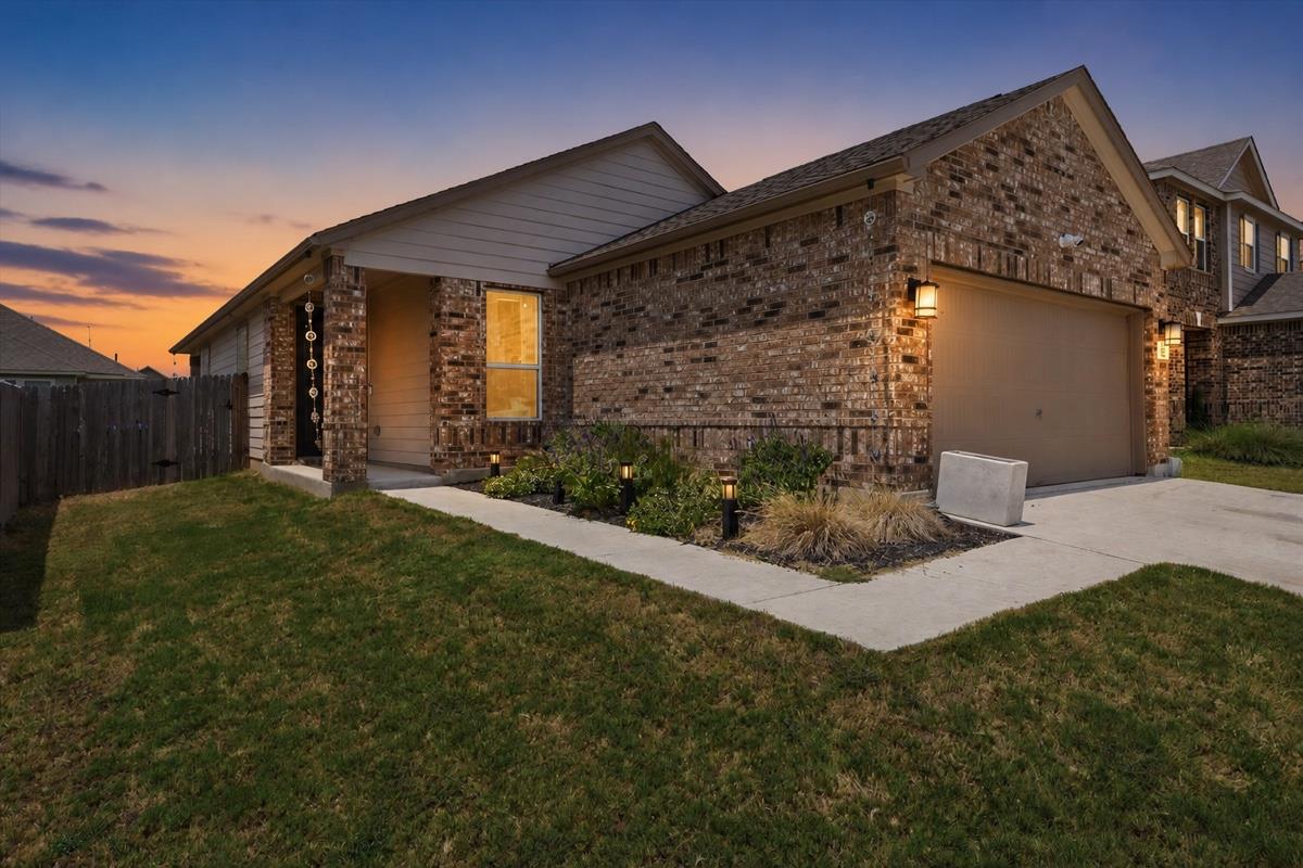 A welcoming front exterior with a brick facade an