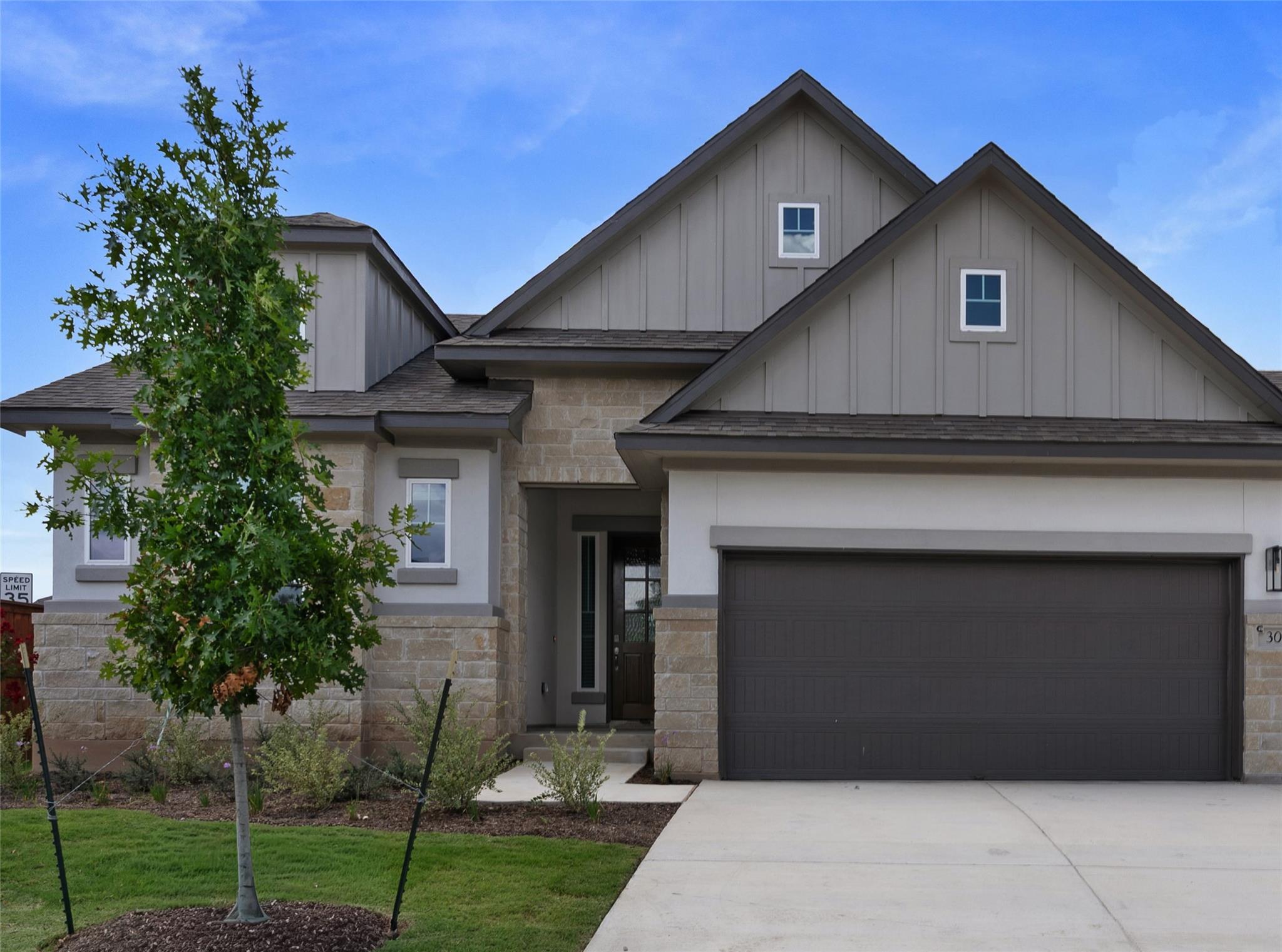 Crafted with stone and siding, this new construct