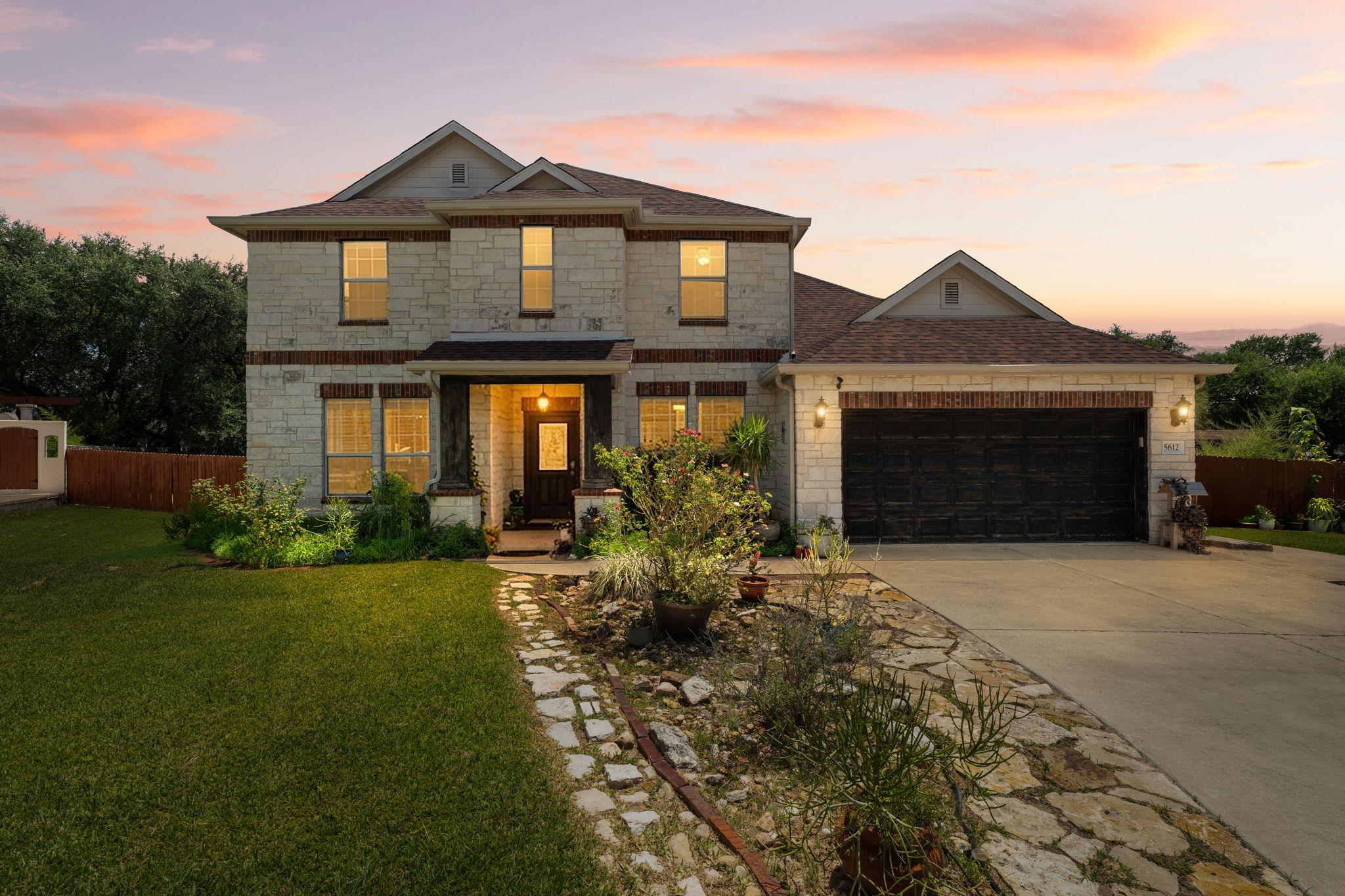 Timeless stone and brick facade welcomes you home