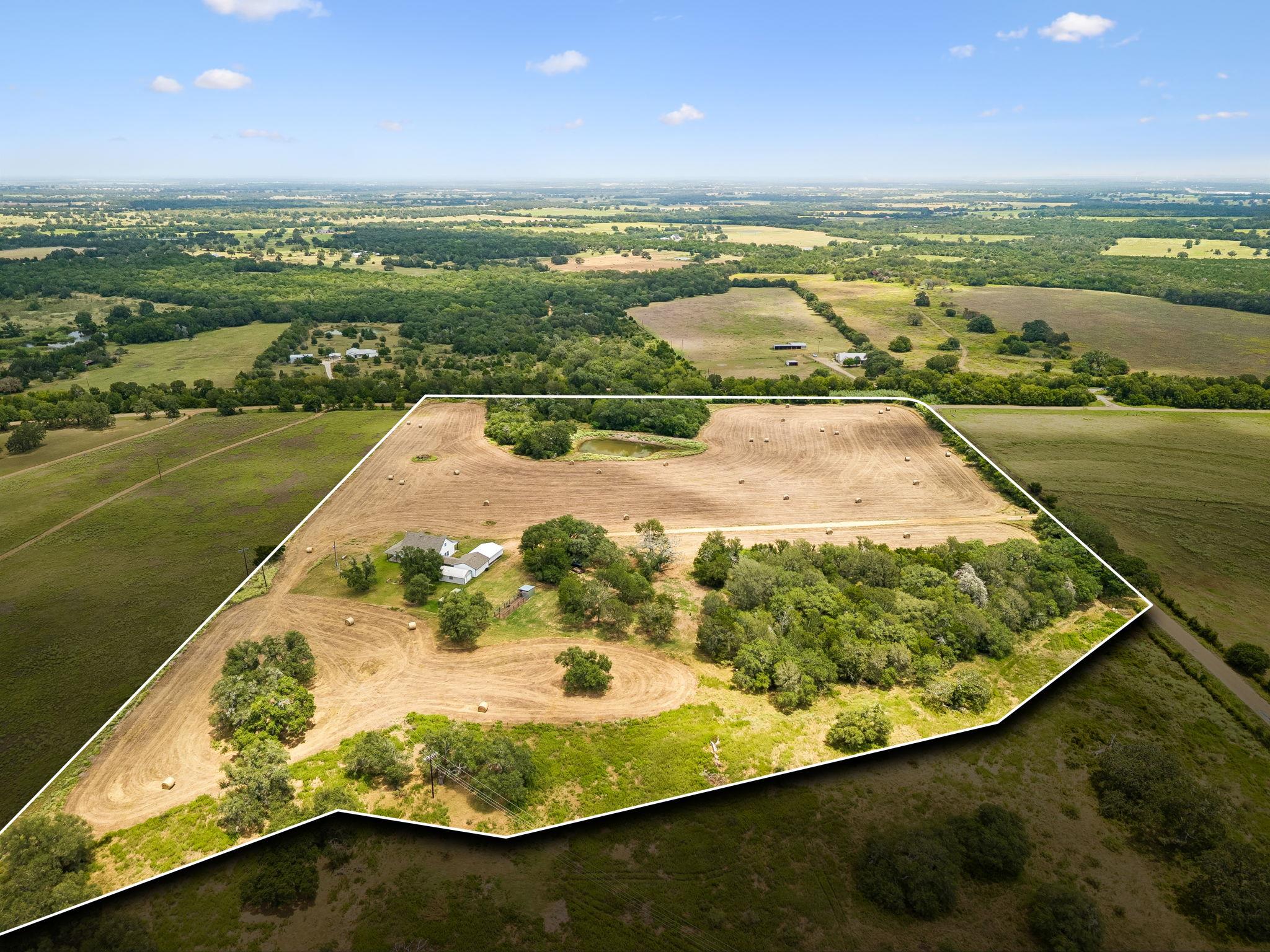 Rolling green hills surround this spacious lot, o