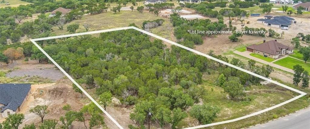 A verdant, undeveloped lot outlined for a custom 