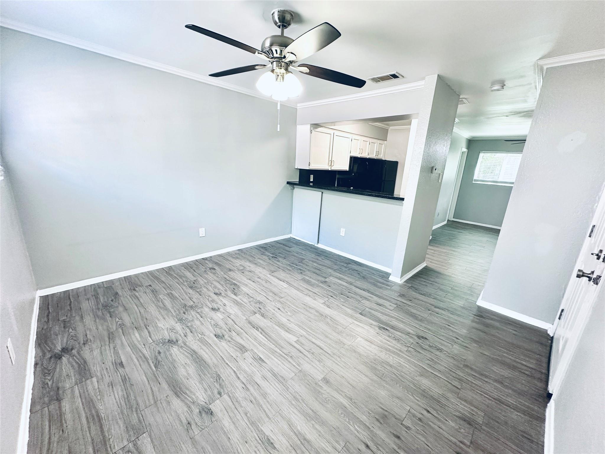 A versatile open floorplan featuring wide plank f