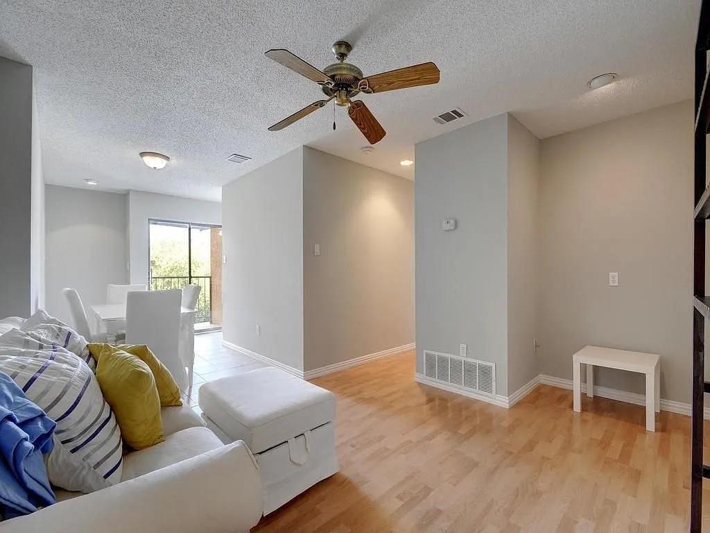 Blonde wood flooring spans this airy living area,