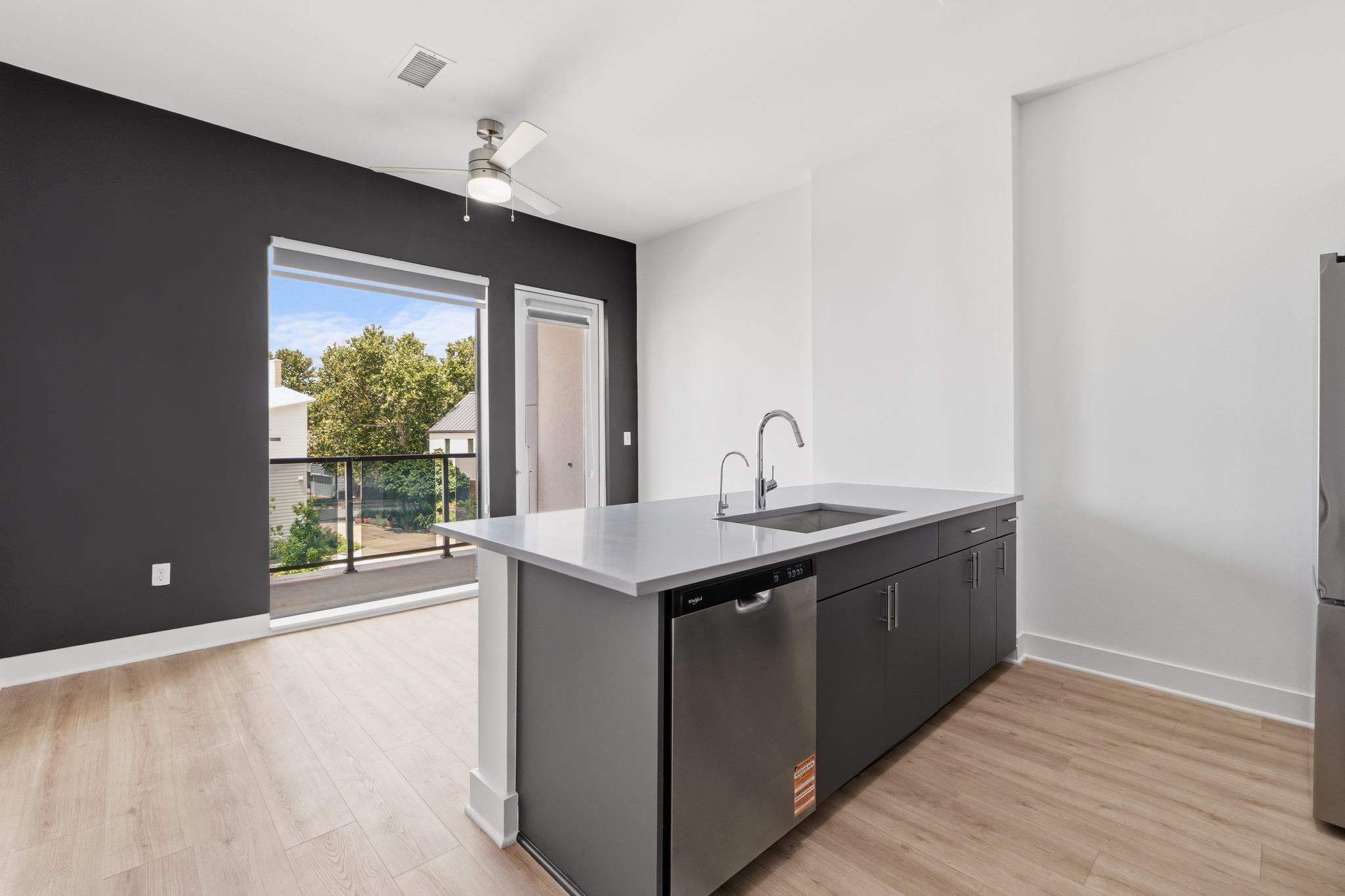 A well-appointed kitchen island with sleek cabine