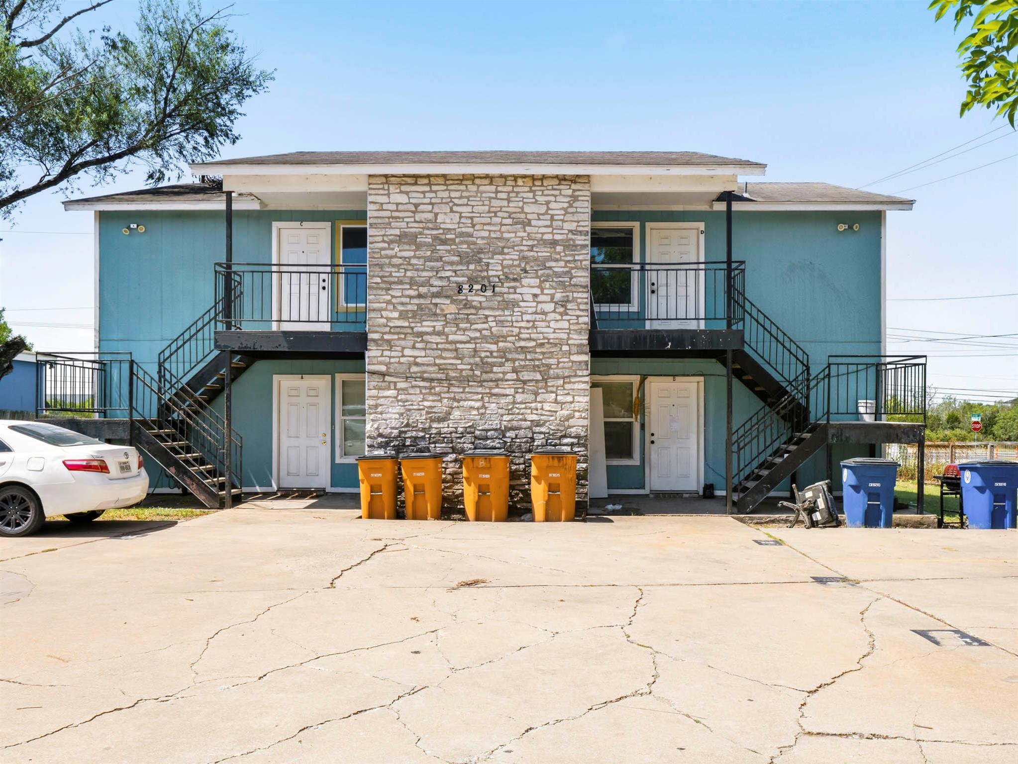 A well-maintained two-story structure features pr