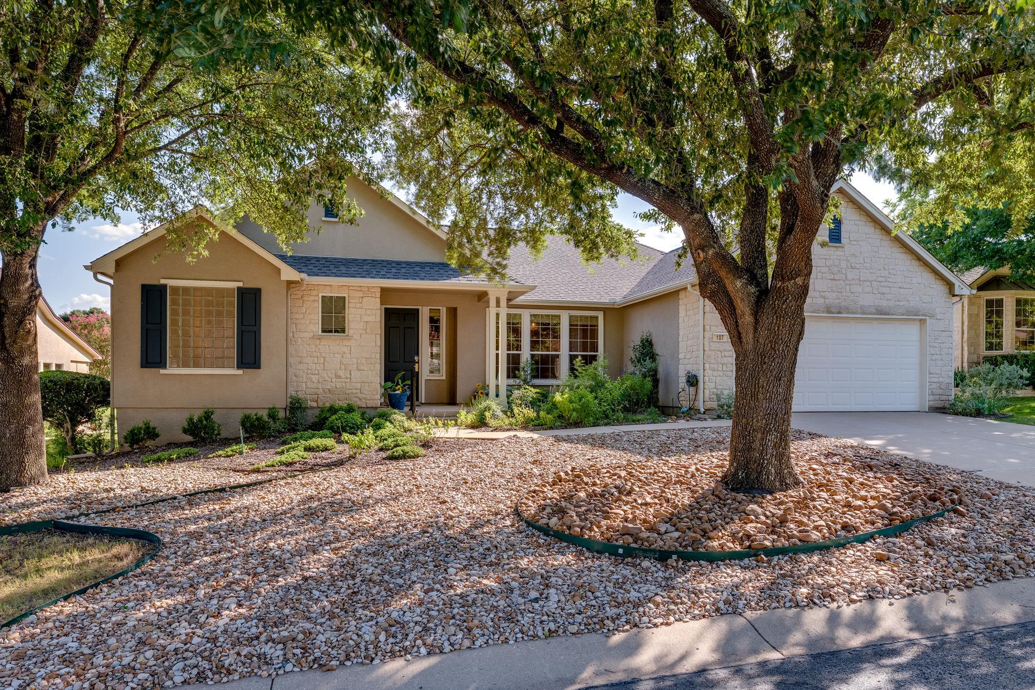 A welcoming facade with stone accents and a well-