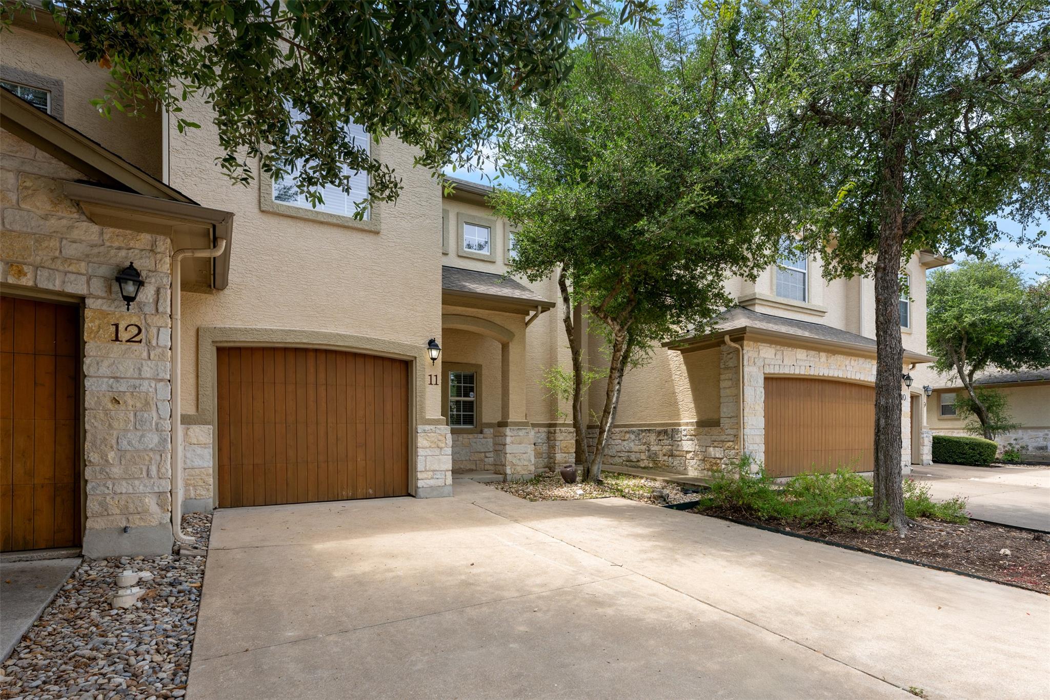 Stone veneer and stucco elevate the architectural