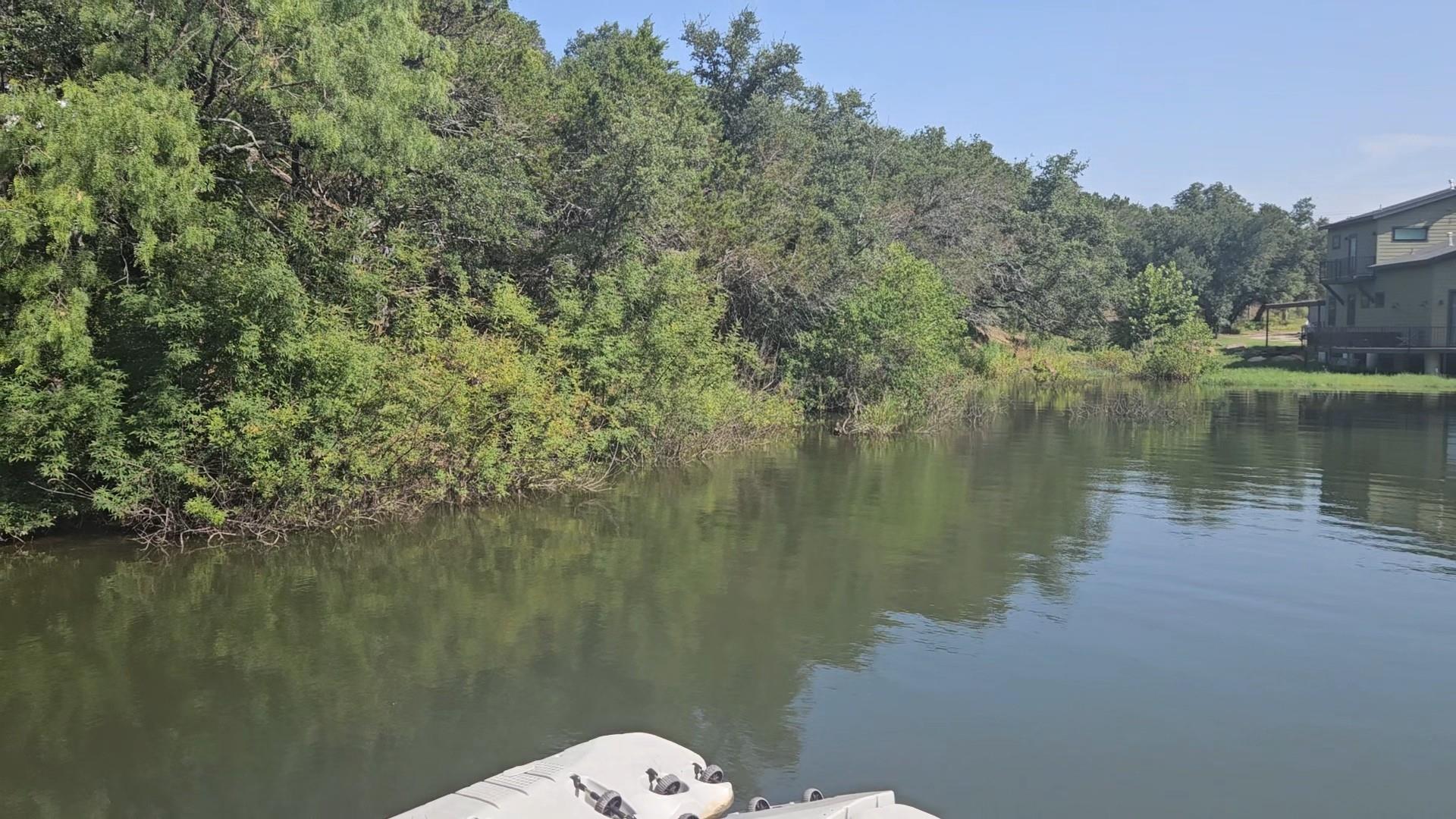 A tranquil lake offers scenic views of verdant tr