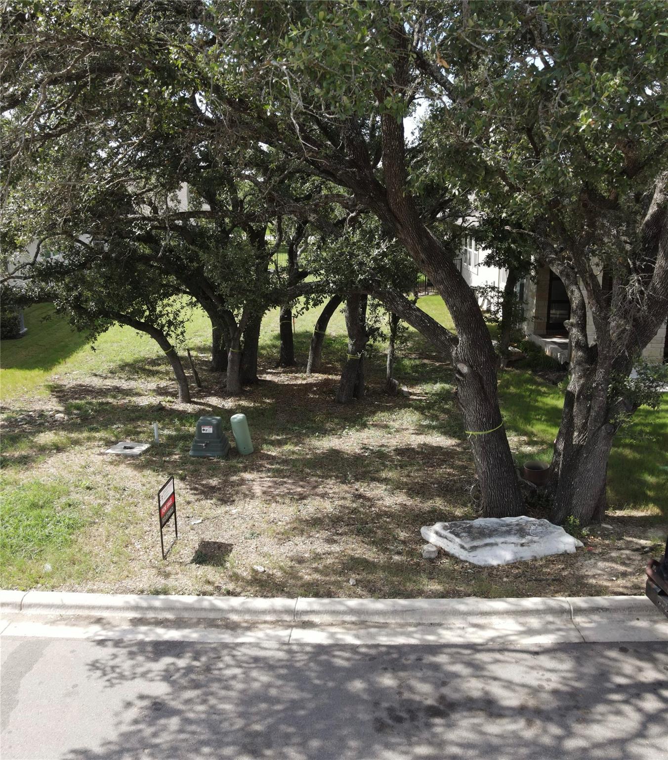 Mature trees shade this generous lot, offering a 