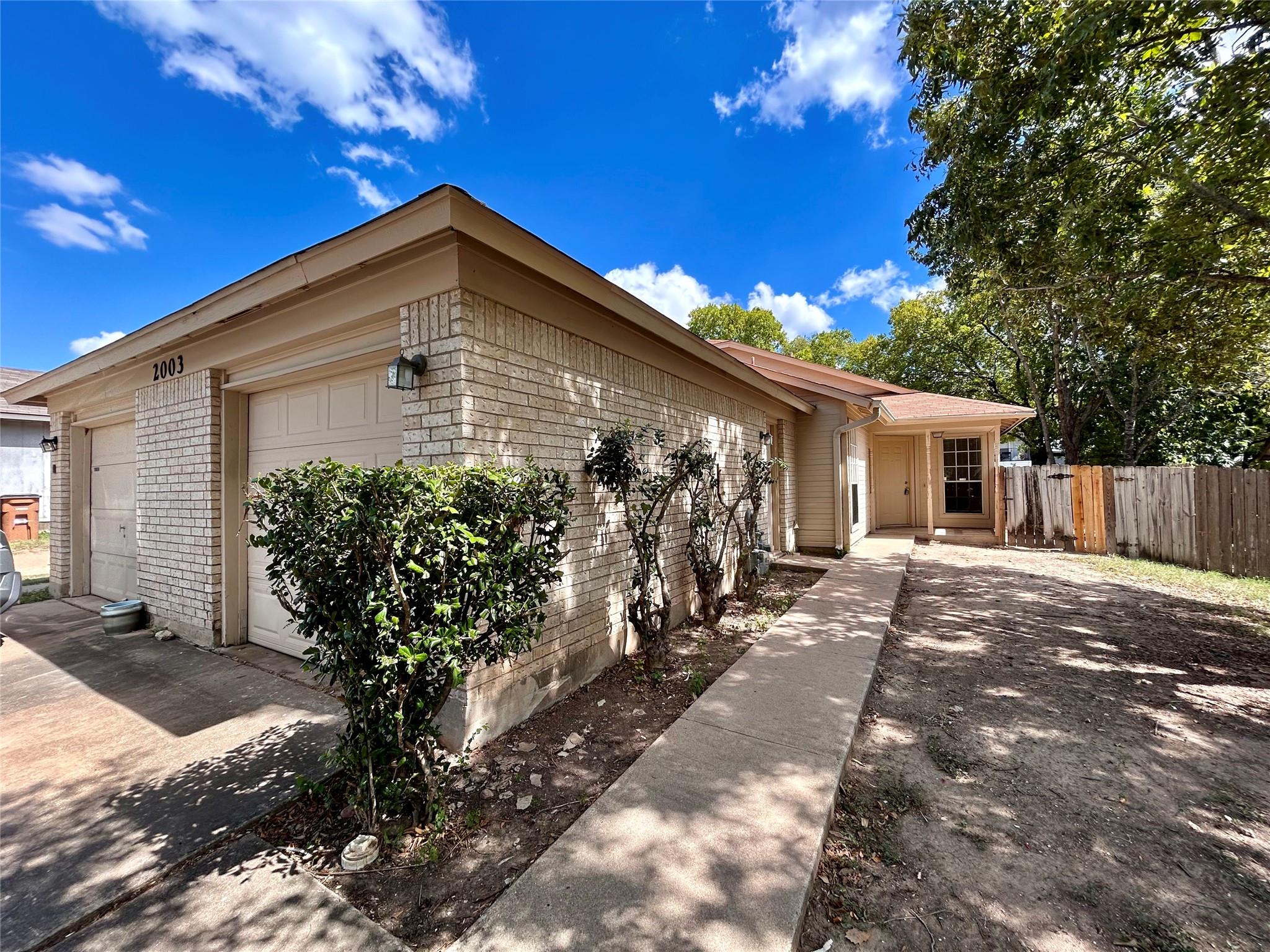 A welcoming brick and siding exterior with an att