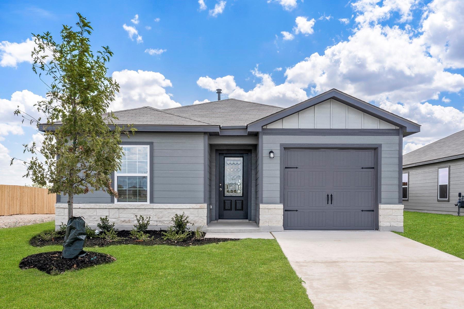 Gray siding exterior with white stone veneer acce