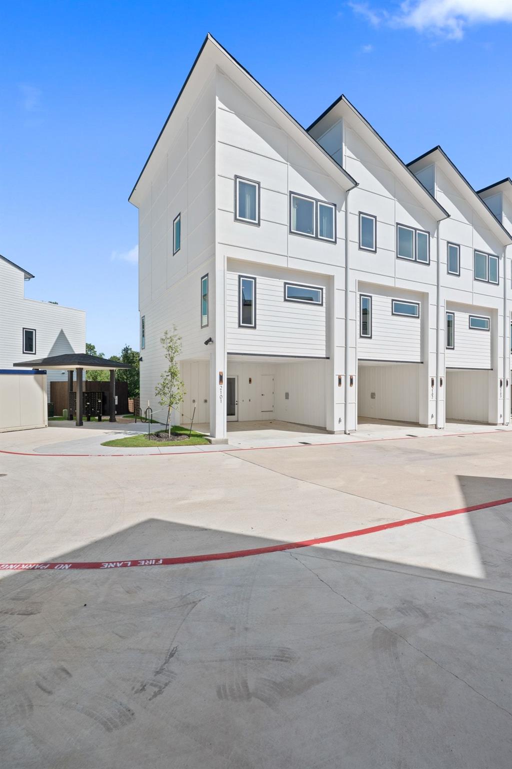 Modern townhomes showcasing crisp white facades, 