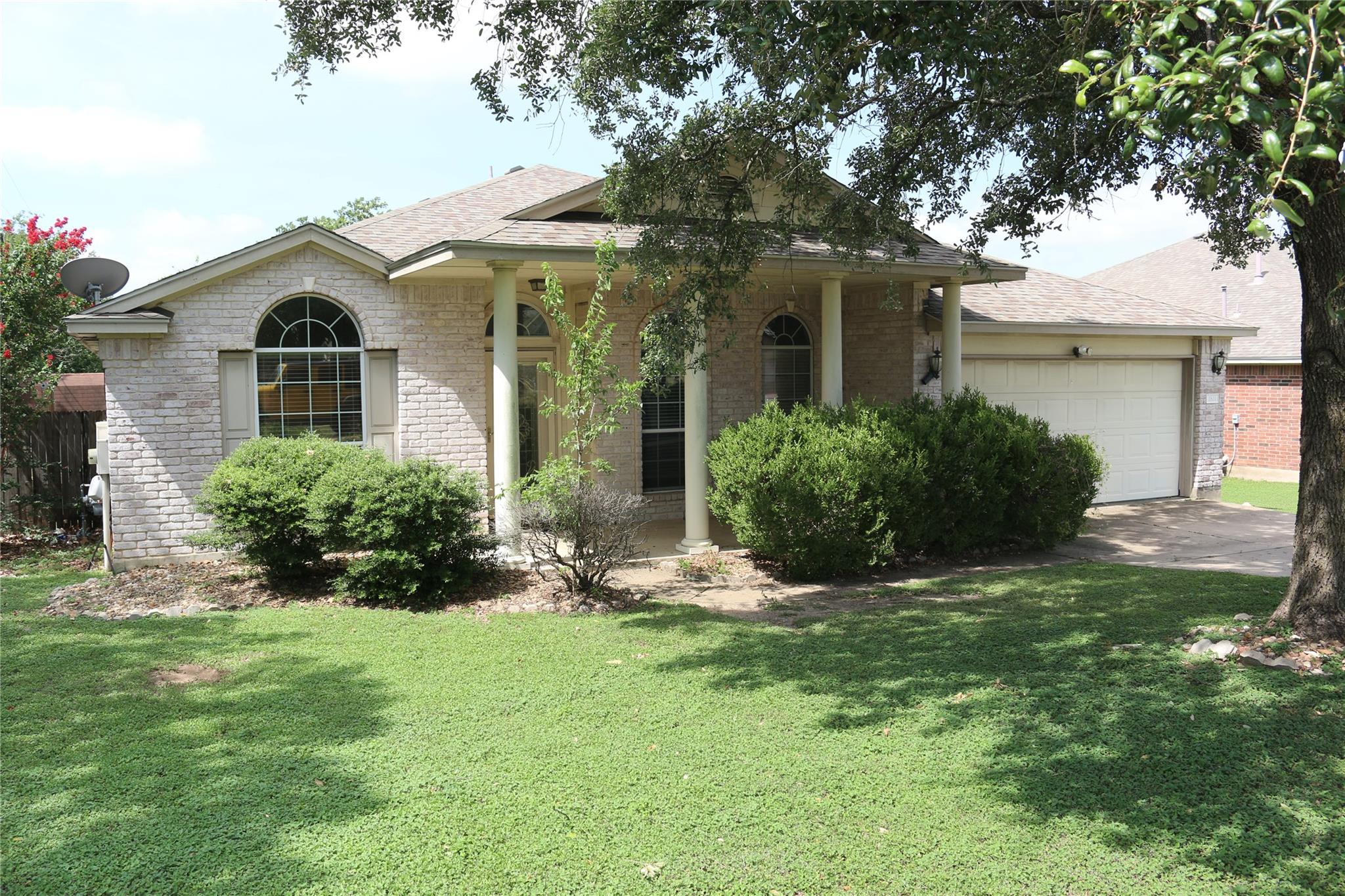 A classic brick exterior with arched windows and 